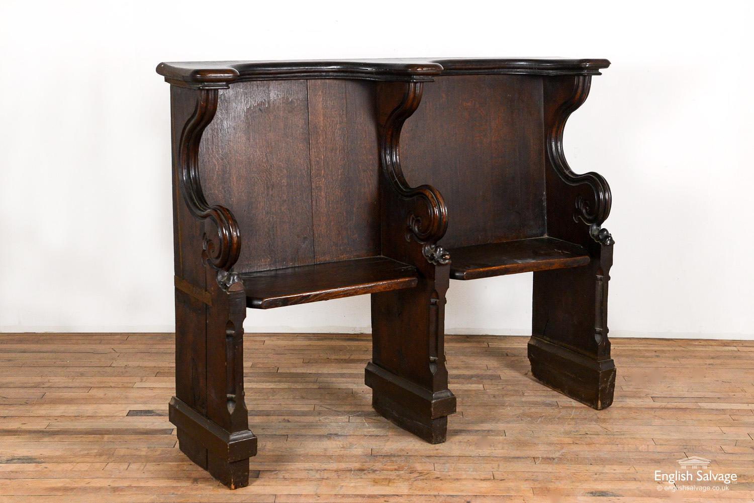 Antique Victorian oak double seated oak choir stall / bench / pew. The stall has attractive scrolling curved arms and chamfering to the front edges of the legs. Age, wear-related surface scratches and nicks are visible throughout and the left arm