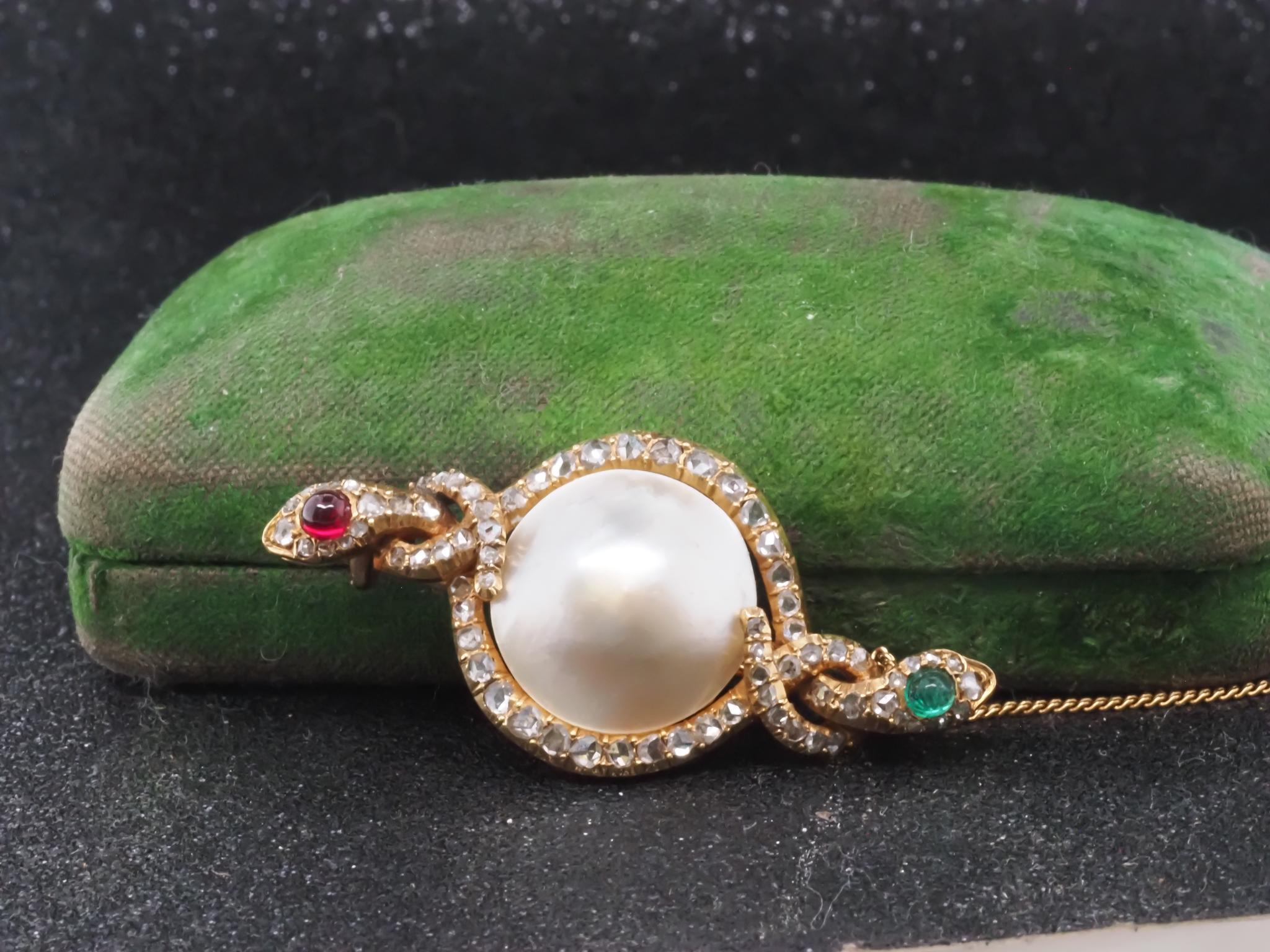 Victorian Double Serpent Rose Cut Diamond, Emerald and Ruby Brooch - VHK#341a

Item Details:
Metal Type: 18K Yellow Gold [Hallmarked, and Tested]
Weight: 8.9 grams

Natural Emerald cabochon and Natural Ruby Cabachon

Diamonds are rose cut, 1.00ct