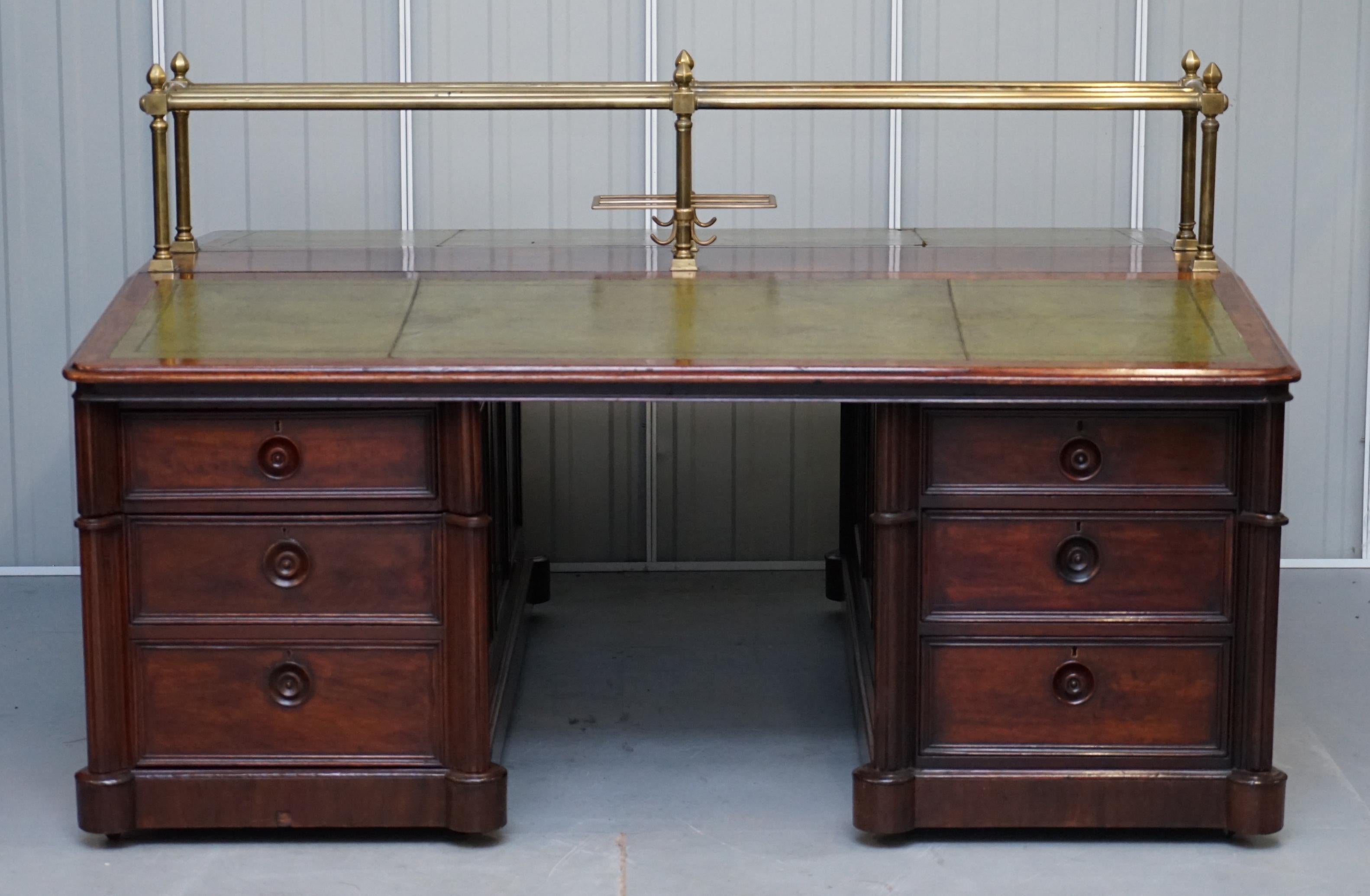 We are delighted to this absolutely sublime early Victorian Honduras mahogany with green leather top and brass reading rail twin pedestal bankers partners desk

What a desk! circa 1840, used in banks for accounting with space to lay out multiple