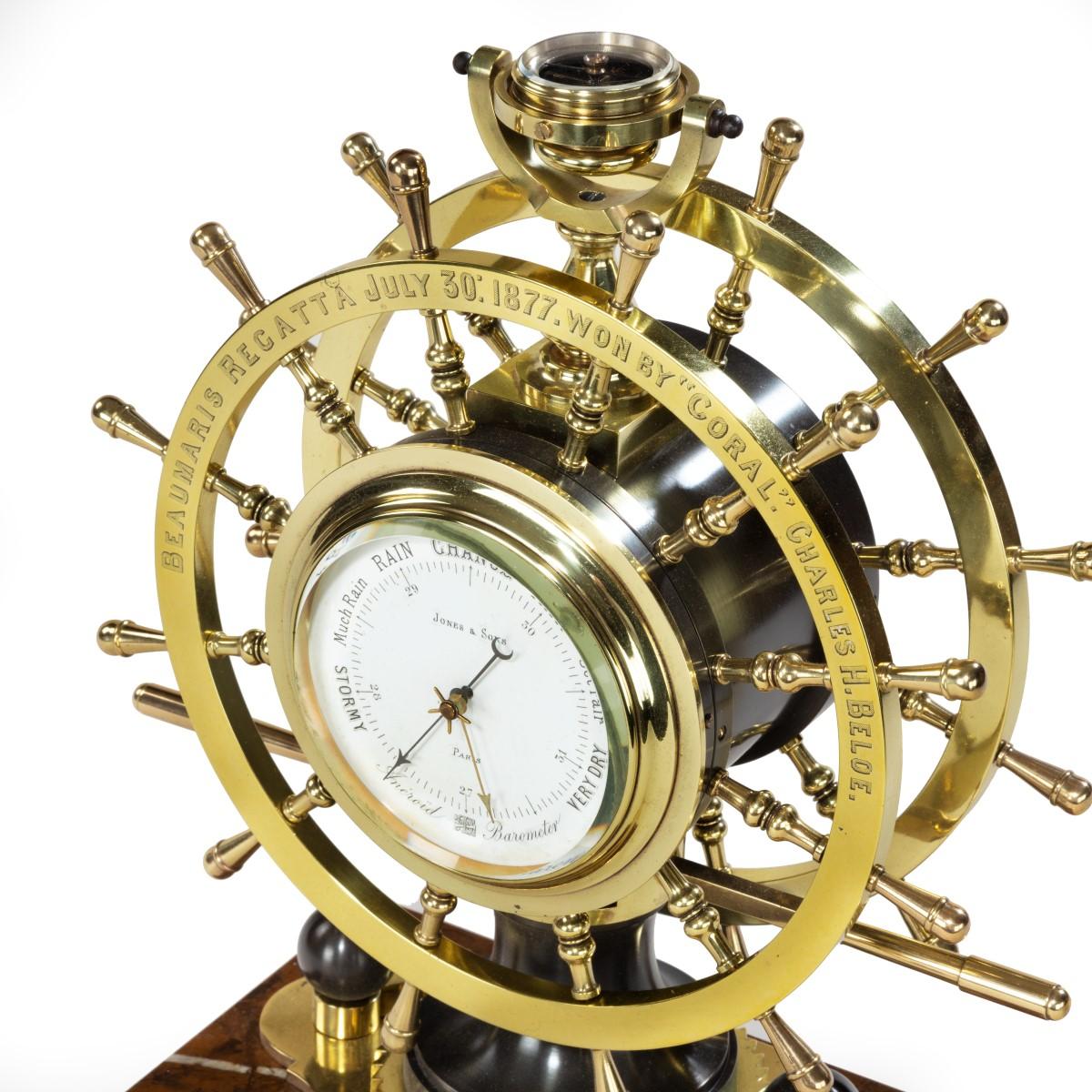 Victorian double steering-wheel desk clock and barometer racing trophy for the Beaumaris Regatta July 30 1877 – won by ‘Coral’ Charles H Beloe, comprising two brass steering wheels, one enclosing a clock and the other a barometer, set upon a