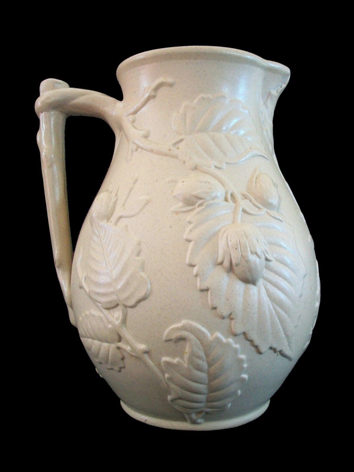 Rare Victorian 'Drabware' stoneware pitcher with embossed strawberries, leaves and branch handle - matte salt glaze to the exterior with gloss glaze to the interior - unsigned - United Kingdom - late 19th century.

Excellent/mint antique condition