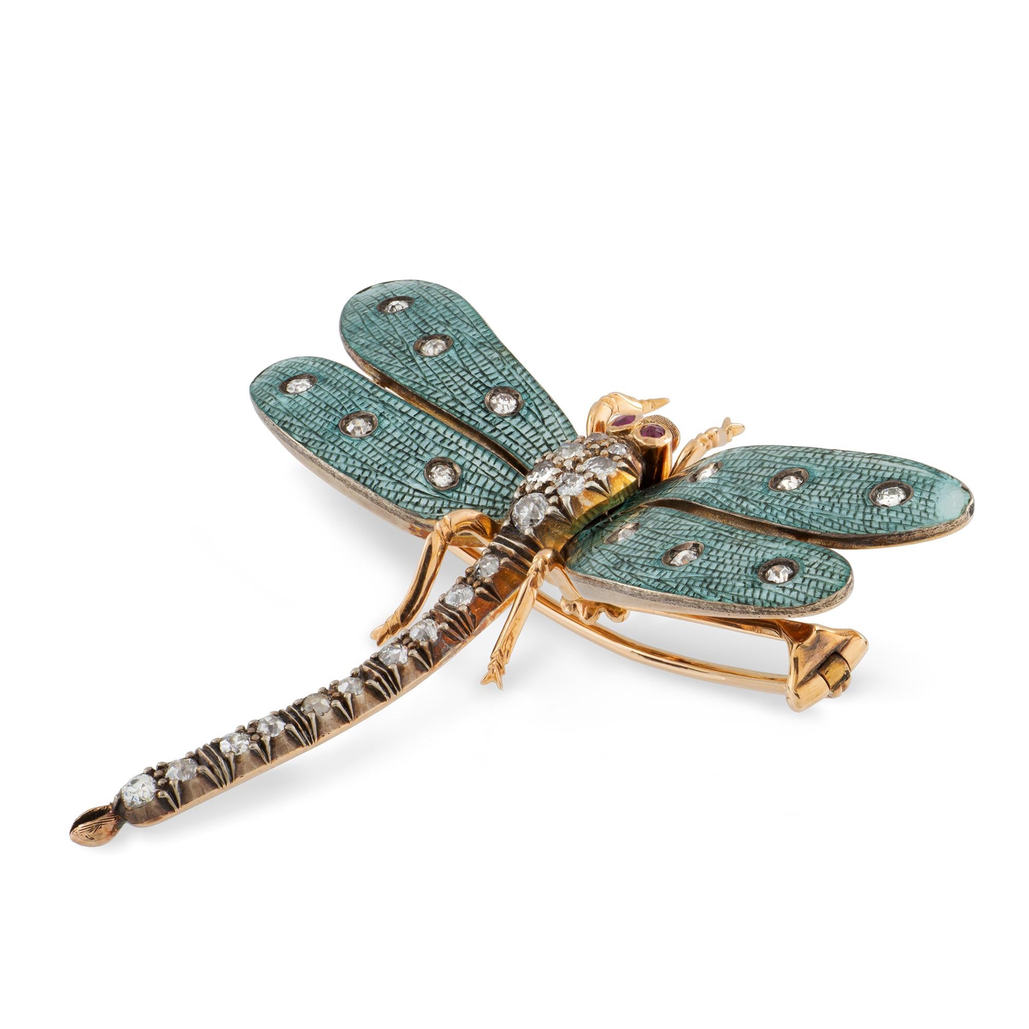 A Victorian dragonfly brooch, the two pairs of wings of blue enamel with veined decoration, each set with three old-cut diamonds, all set to a yellow gold mount, wing span measuring approximately 5.5cm, the body and delicately curved tail encrusted
