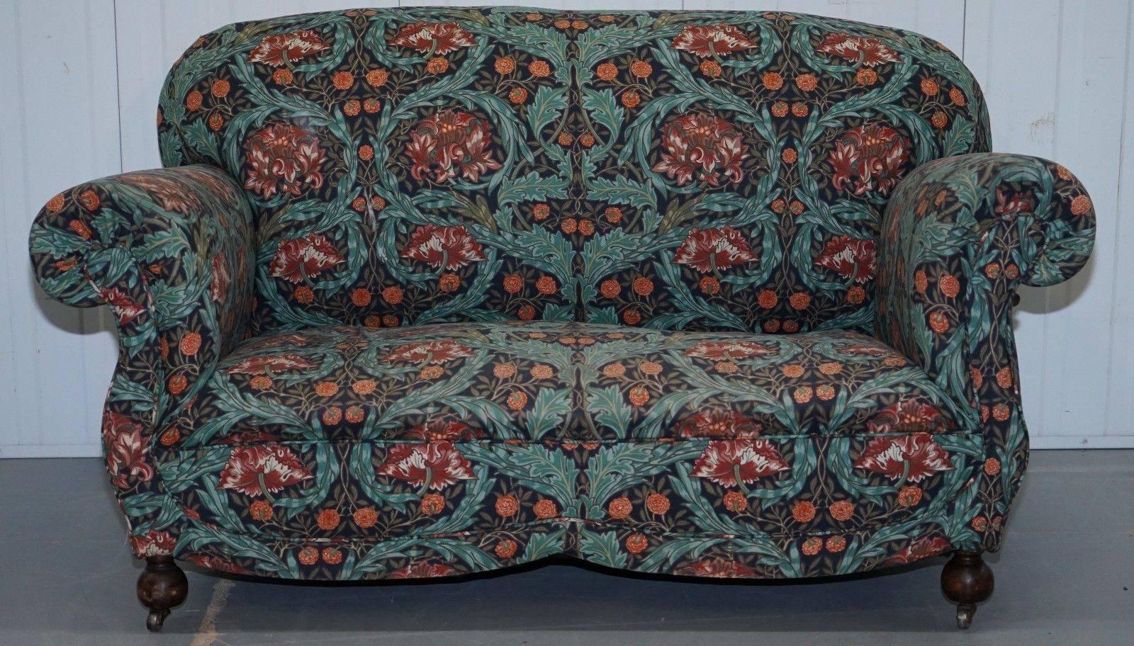 We are delighted to offer for sale this lovely William Morris upholstered Victorian drop arm sofa chaise part of a suite

I have included a picture of the pair of matching club armchairs, they are not included in this listing but are listed under