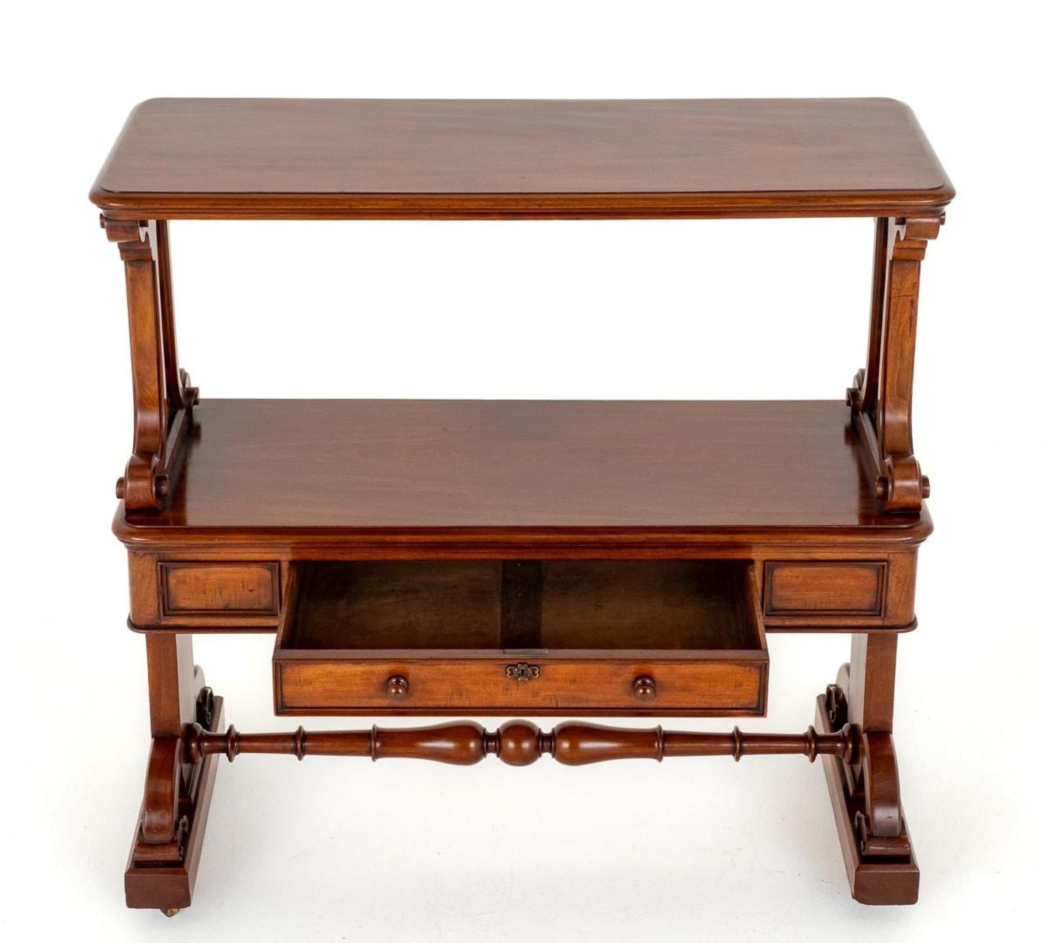 This Victorian  dumb waiter features 1 mahogany lined drawer and has rather unusual end supports
Great piece as a bookcase or shelf unit
Circa 1860
Will ship to anywhere in the world - including US - so please get in touch for a shipping quote .