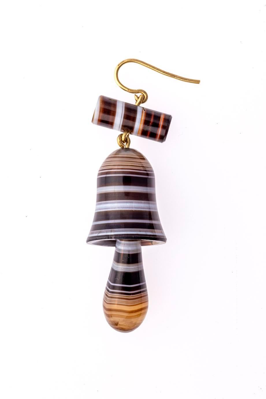 A pair of Victorian Banded Agate Bell Earrings are the result of a stone cutters creativity. You can read the jewelers mind as you study these Earrings. How does he get the most out of this piece from the earth. How does he use the striation. The