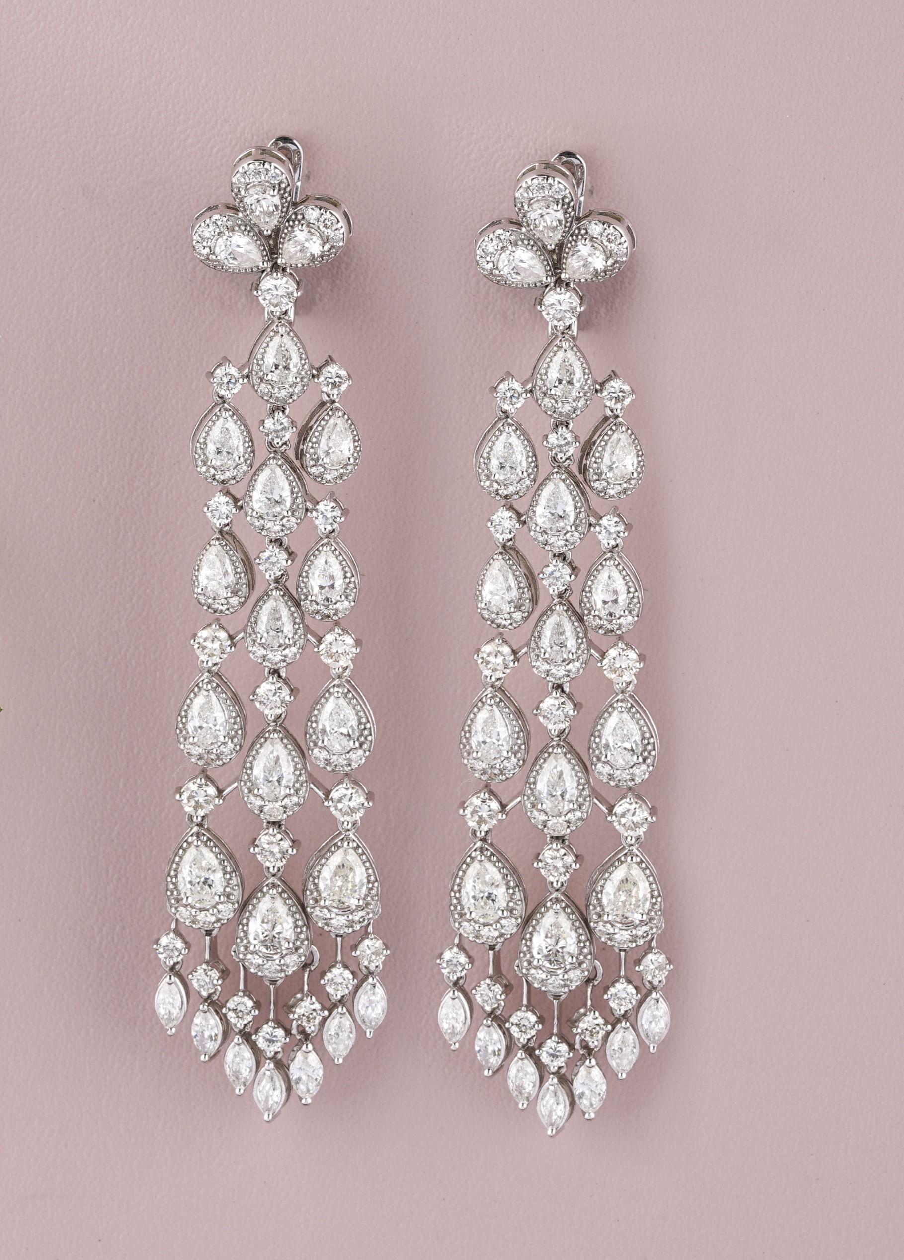 Adorn yourself with these magnificent 18k solid gold chandelier earrings. These earrings are meticulously crafted with a stunning arrangement of pear and marquise-shaped diamonds, cascading elegantly to create a dazzling effect. Each earring