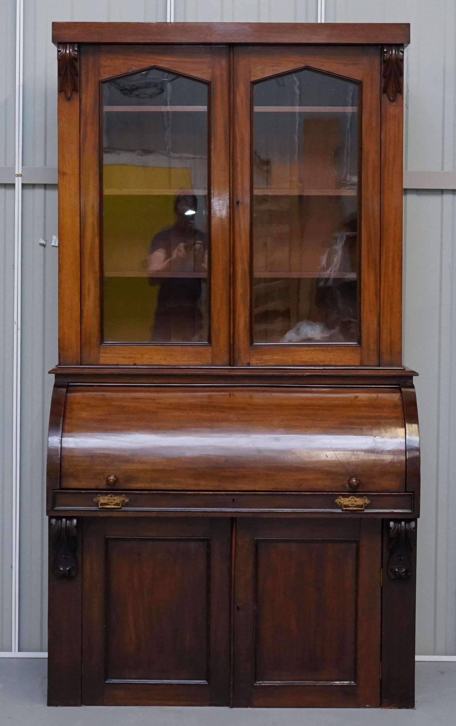 We are delighted to offer for sale this lovely original circa 1870 Victorian Eastlake cylinder roll top secretaire desk bookcase

A good looking well made and multi-functional piece of furniture. The top section is a glazed cabinet bookcase with