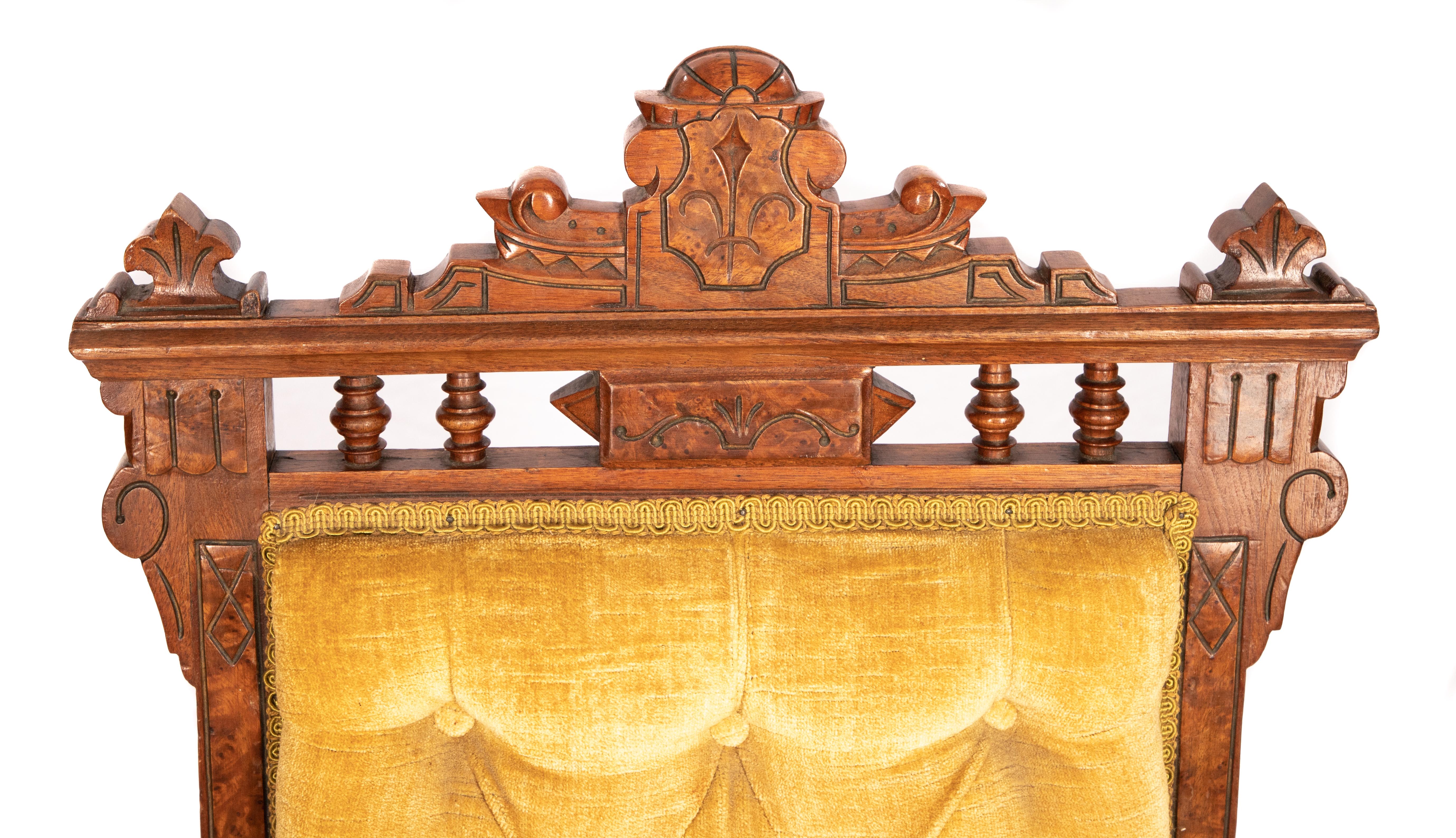 Offering this gorgeous Eastlake parlor chair. Starting on turned front legs with casters it rises to the seat covered in beautiful gold velvet. The geometric back rises to hand carved detail that frames the back upholstery.