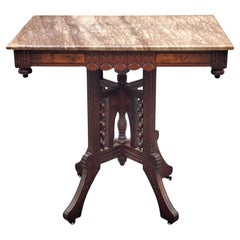 Victorian Eastlake Style Walnut and Marble Top Rolling Center Table