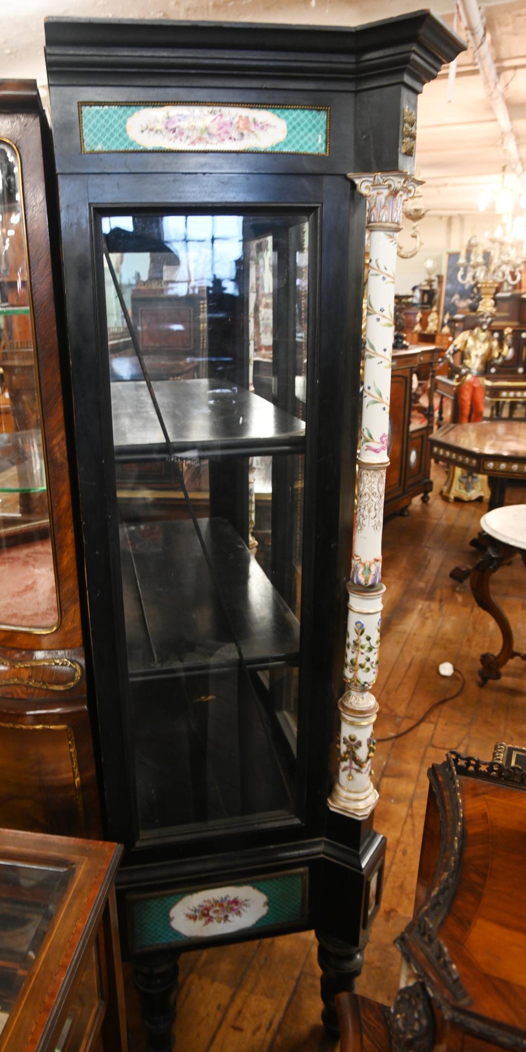 Victorian ebonised two door display cabinet with porcelain columns and pictorial plaques
Again the colour interplay between the black and white porcelain very distinctive
Circa 1840
Columns and plaques are intricately hand painted
Bought from a
