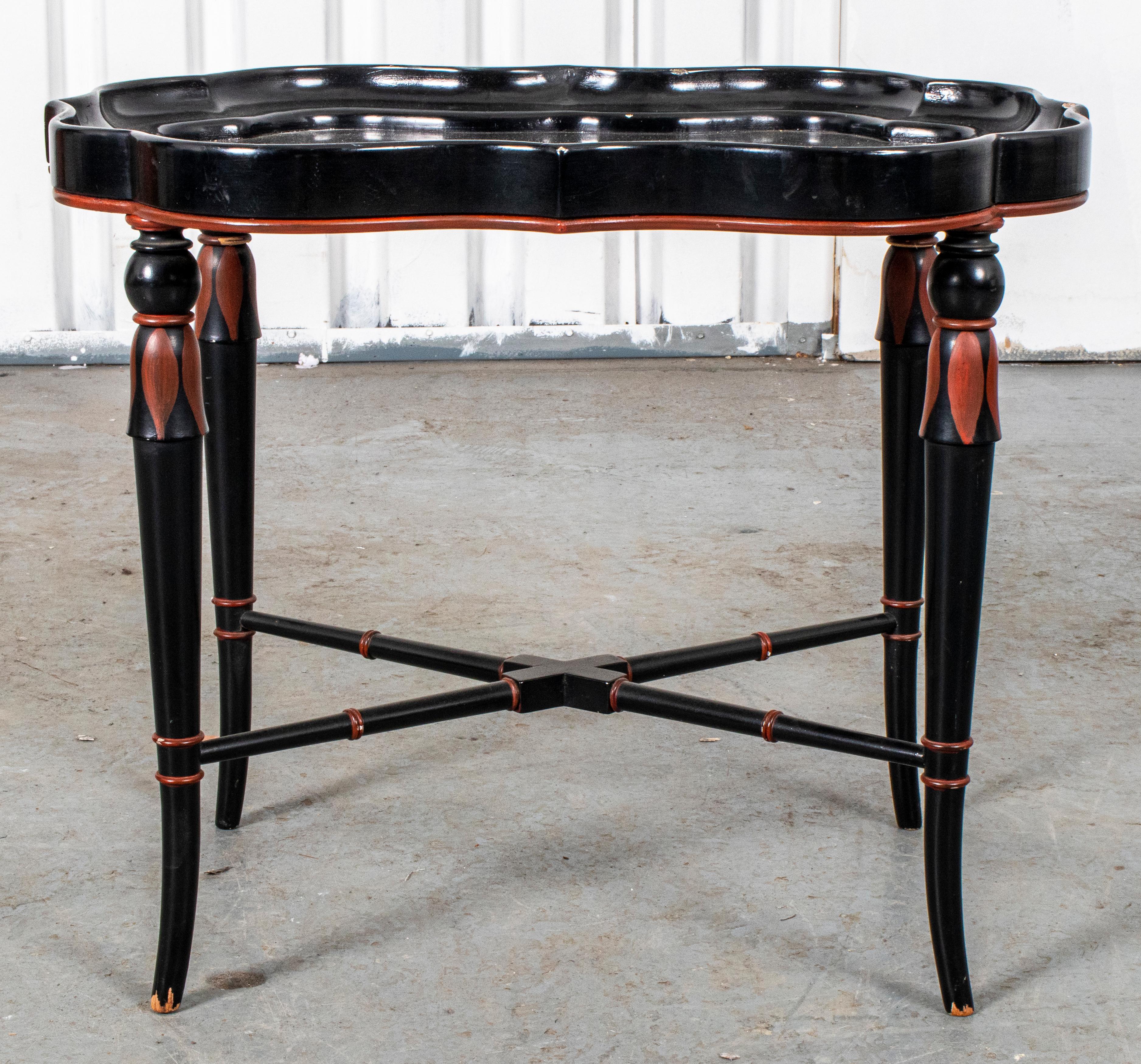 Victorian ebonized tray side table with scalloped borders and parcel painted legs. Measures: 18