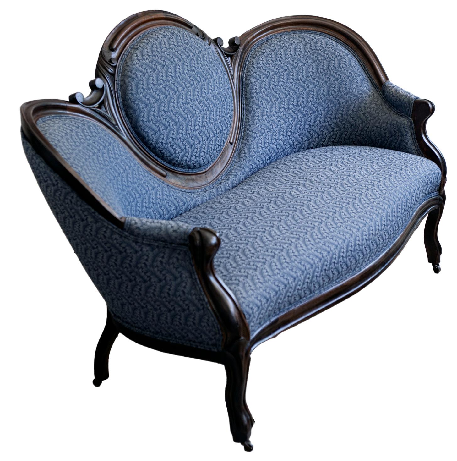 Charming 19th Century handcrafted parlor sofa reupholstered in heavy weight fabric in dark blue. The sturdy walnut frame has been lightly ebonized. 