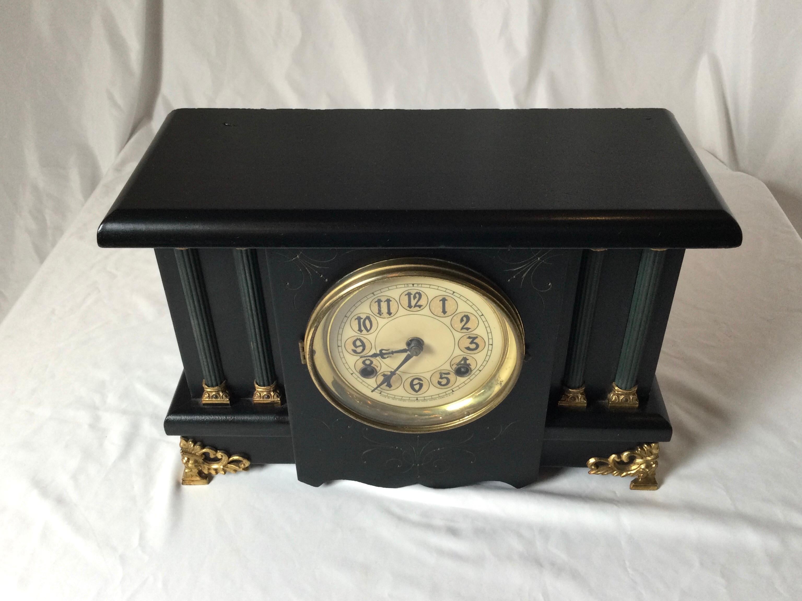 Neoclassical back wood mantle clock. Strikes on hour and half hour with a deep resounding gong. With key and pendulum. Working order but clocks may need adjustment after shipping.