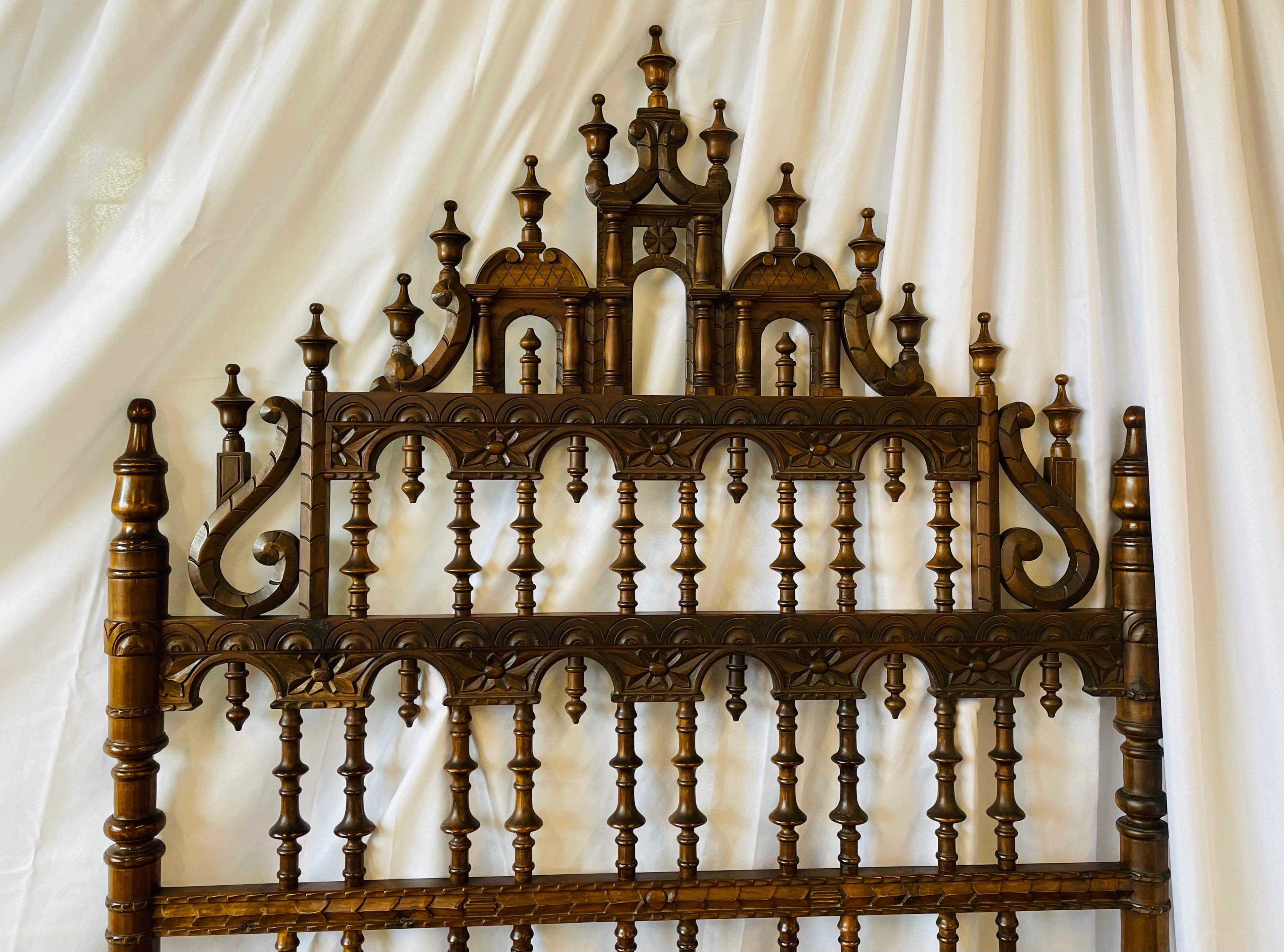 Queen/ full sized headboard in the Jacobean Style. Having spindle carvings throughout the step up stain design. This bed mounts onto the existing bed in your home.