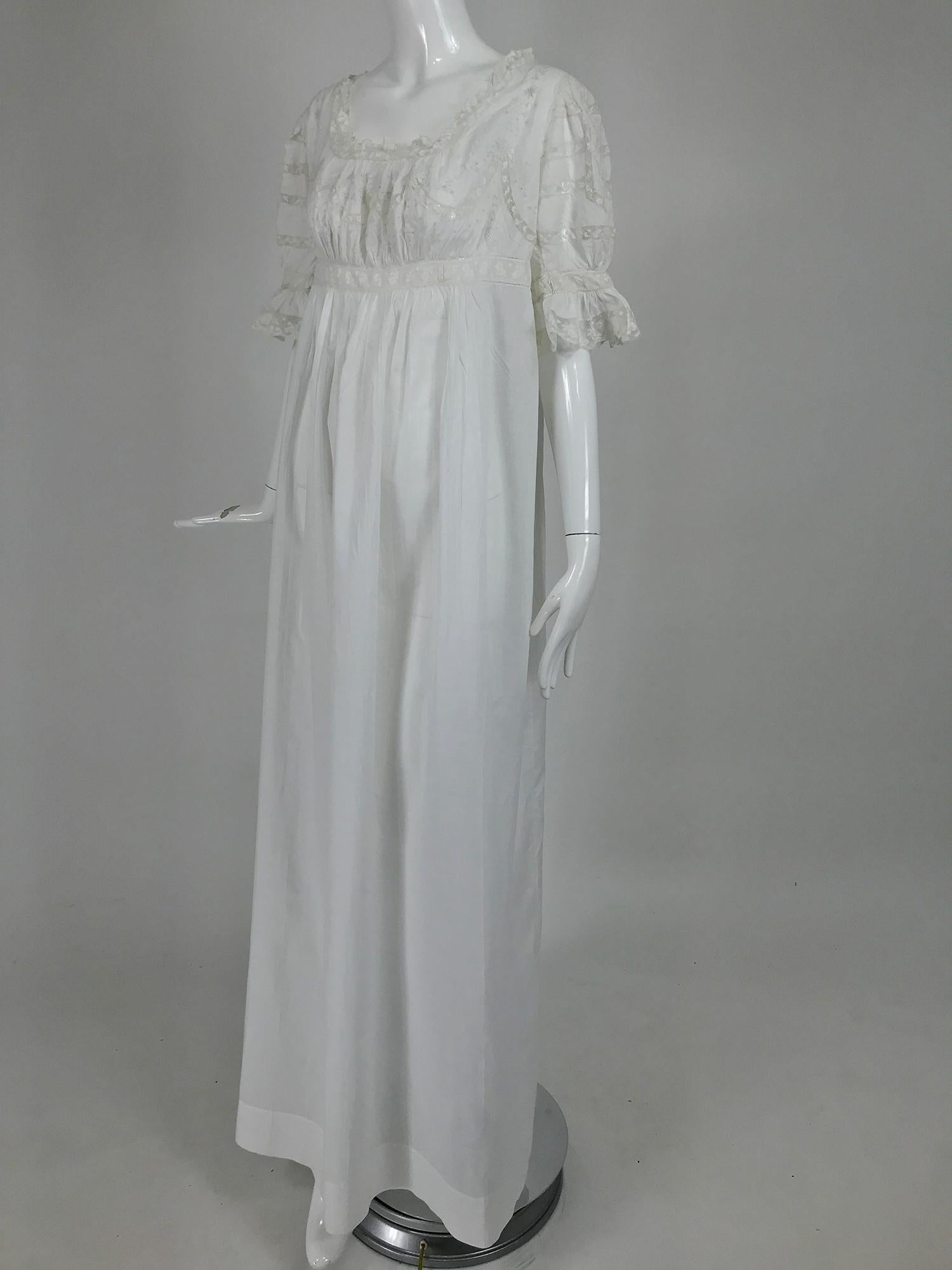 Victorian embroidered cotton batiste lace gown embroidered with the name Hattie from the early 1900s. This beautiful gown was never worn, it still has the pencil order number written on the upper back. It has the name of the owner Hattie embroidered