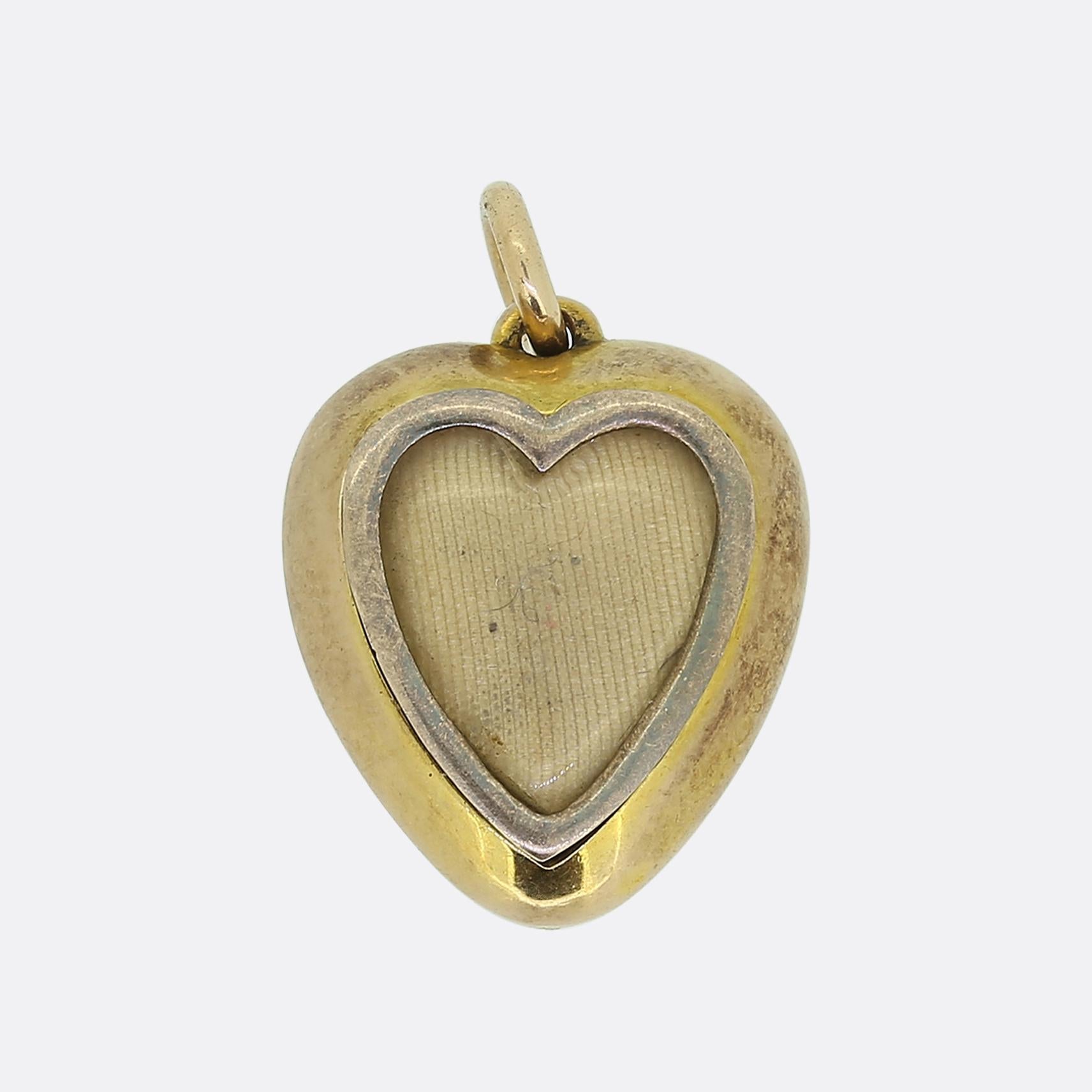 Here we have a delightful locket pendant dating back to the Victorian era. This romantic piece has been crafted into the shape of love heart with a single round faceted emerald set at the centre. A vast array of round seed pearls pervade the rest of