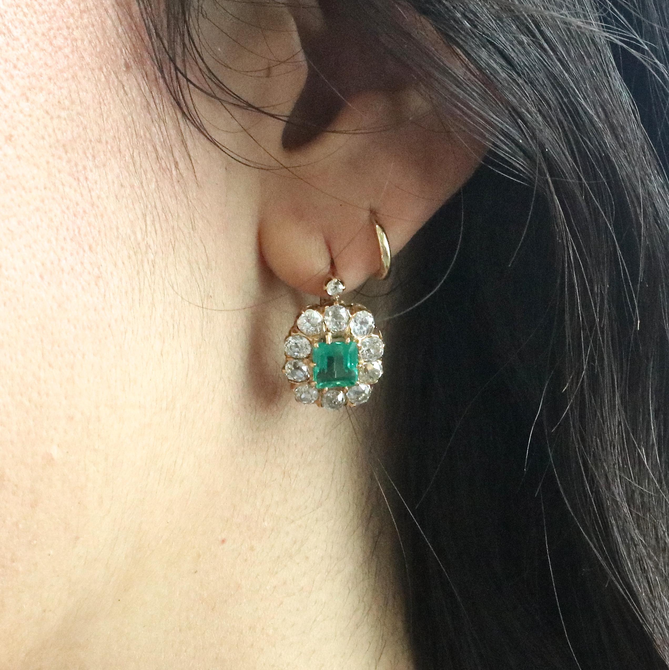Classic Victorian earrings that are still so good looking after all these years. A great addition to your earring collection. The lively emeralds weigh approximately 2.10 carats, surrounded by 22 old European cut diamonds  weighing approximately