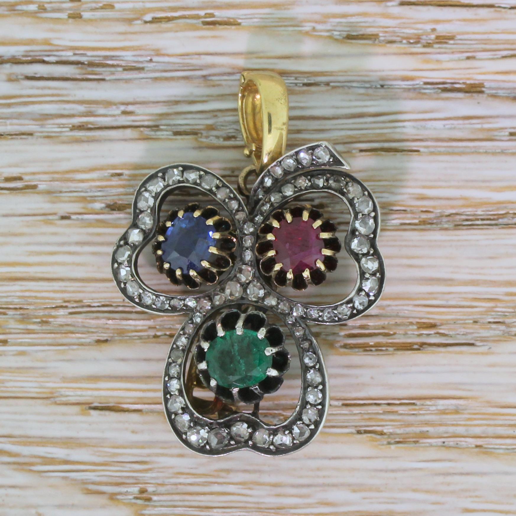 A top class example of Victorian jewellery. This highly adaptable piece can worn as a brooch or, with the removable pin unscrewed, as a pendant. Each of the three leaves is set with a precious gem; an emerald, a ruby and a sapphire. Seventy-one rose