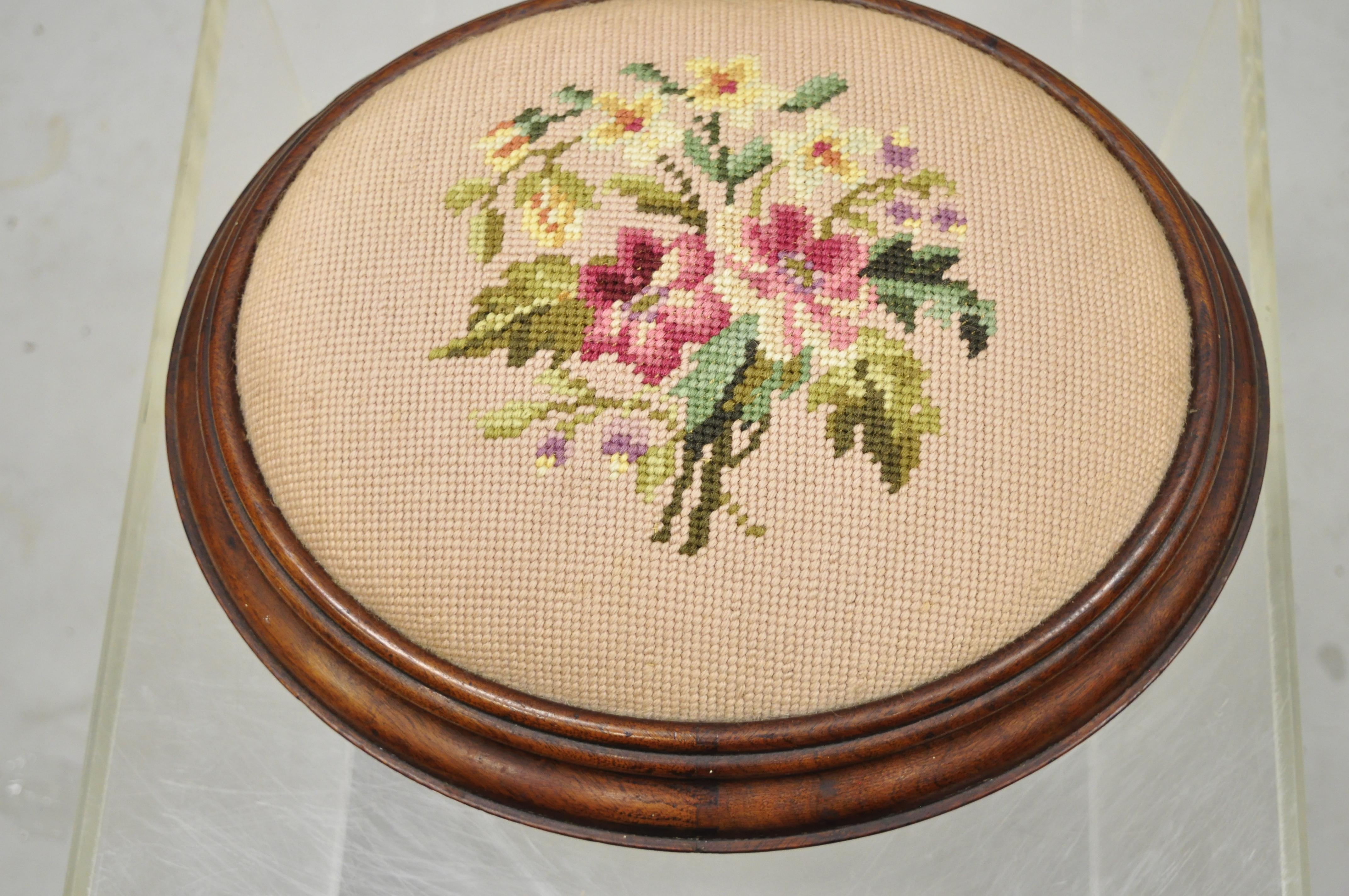 Antique Victorian Empire Pink Needlepoint Oval Mahogany Petite small ottoman footstool. Item features unique oval shape, mahogany wood frame, bun feet, floral needlepoint upholstered seat, beautiful wood grain, very nice antique item. Circa 19th