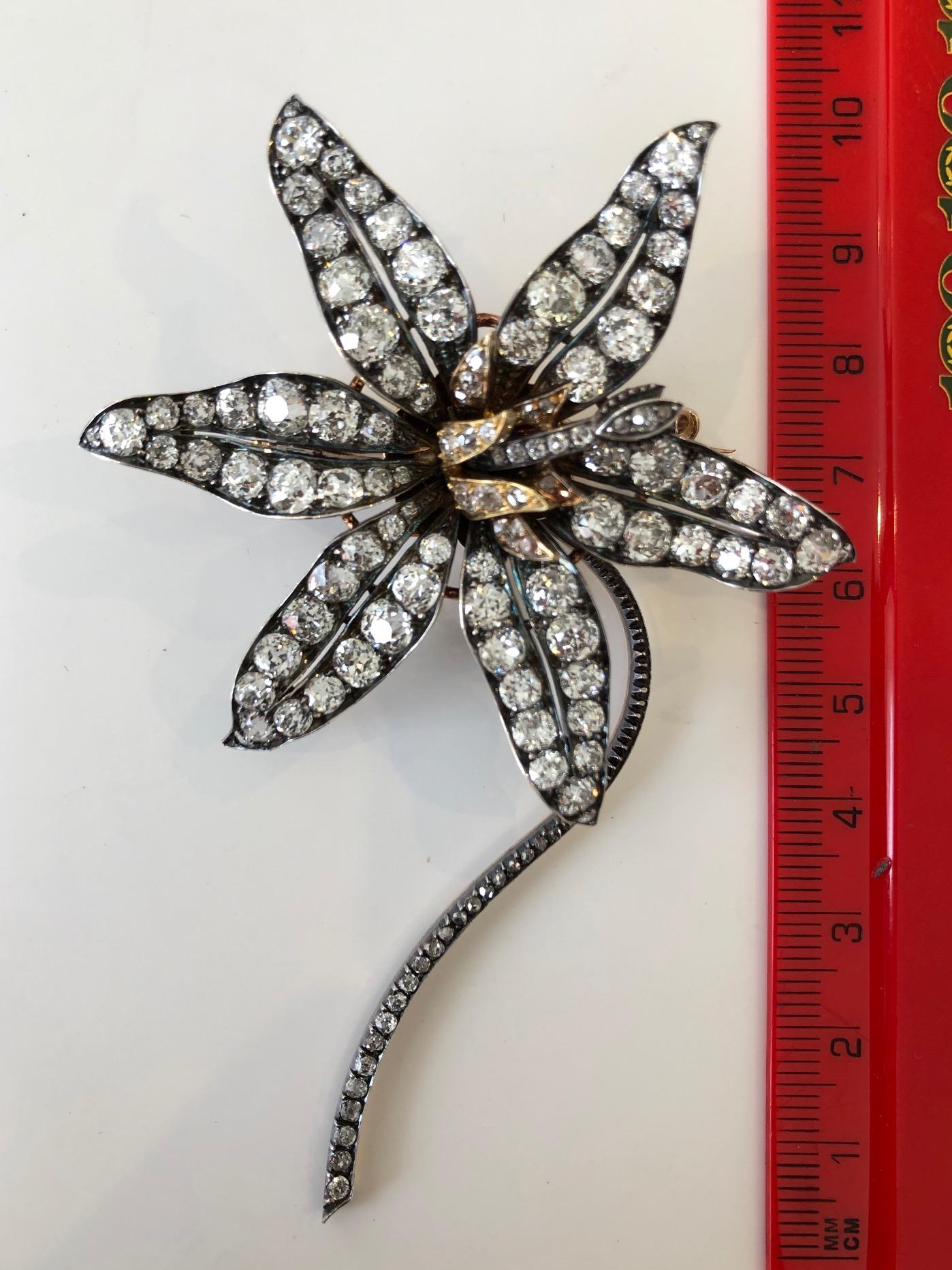 Victorian En Tremblant Flower Brooch With 20 carats of Diamonds in Fitted Box
A large and unusual Victorian en tremblant flower brooch designed as a stargazer lily. The brooch contains approximately 20 carats of old mine brilliant cut diamonds. This