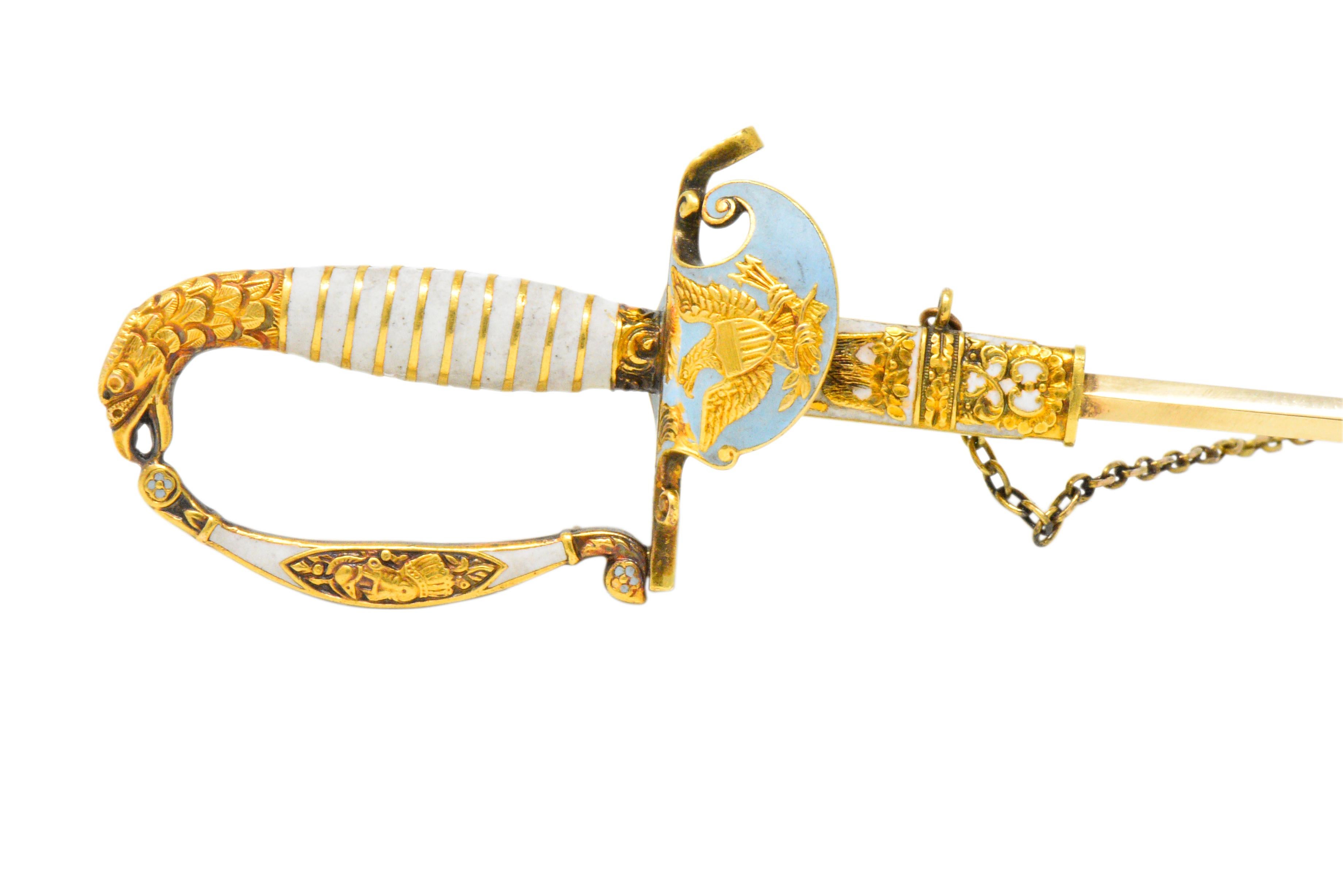 Designed as a military saber with chain and removable sheath 

Featuring white and blue enamel (minor loss)

Highly detailed gold engraving with eagle head handle and American seal

Tested as 18 karat, sword blade tested as 14 karat

Total Length: 5