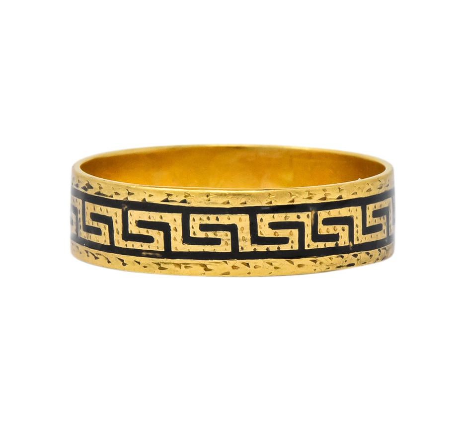 Flat band featuring black enamel in a Greek key motif all the way around

Delicate gold textured detail

Inside inscribed with ‘Clem’

Tested as 14 karat gold

Ring Size: 6 & Not Sizable

Top measures 5.1 mm and sits 0.7 mm high

Total Weight: 2.5
