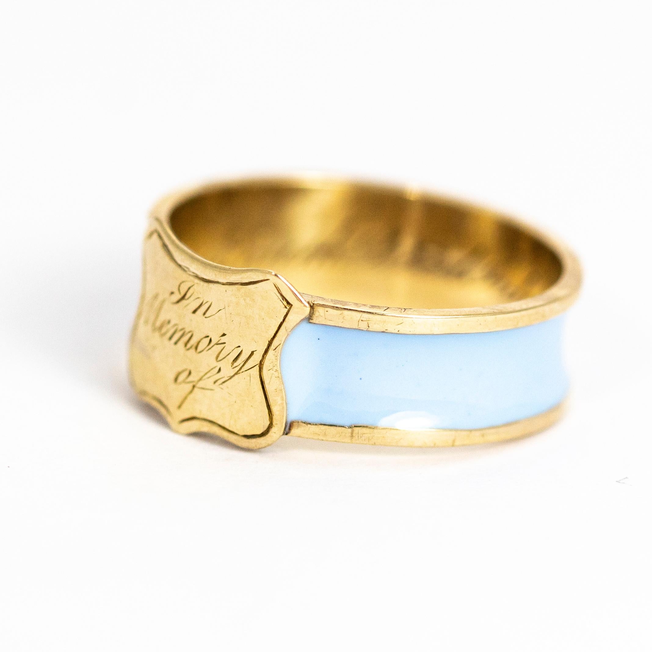 This lovely example of an enamel mourning ring has pastel enamel that flows all the way around the band. The shield has 'In Memory Of' inscribed and on the inside of the band the words 