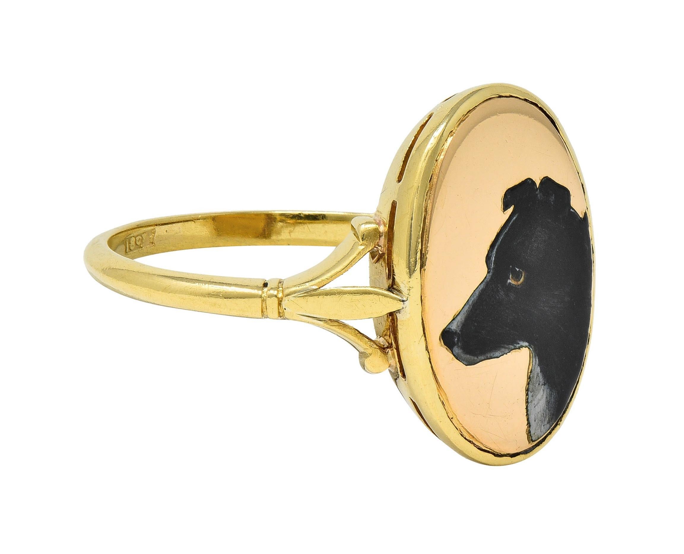 Designed with an oval-shaped form featuring a painted enamel portrait of a border collie dog
Depicted in profile with opaque brown, black, and white fur and light brown eyes
With high polish gold surround, grooved edges, and pierced gallery
Flanked