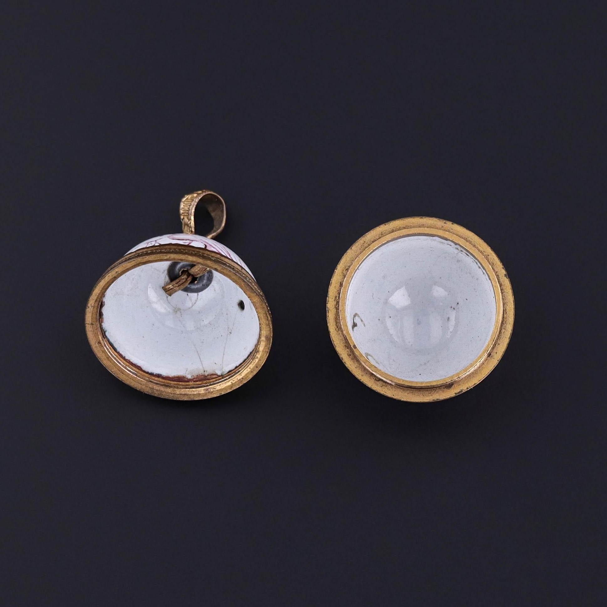 Victorian Enamel Orb Locket Depicting the Earth (c. 1850–1870)

An exquisite artifact of mid-19th century design, this rare Victorian locket (circa 1850–1870) takes the form of a copper orb, intricately adorned with white and pink enamel that maps
