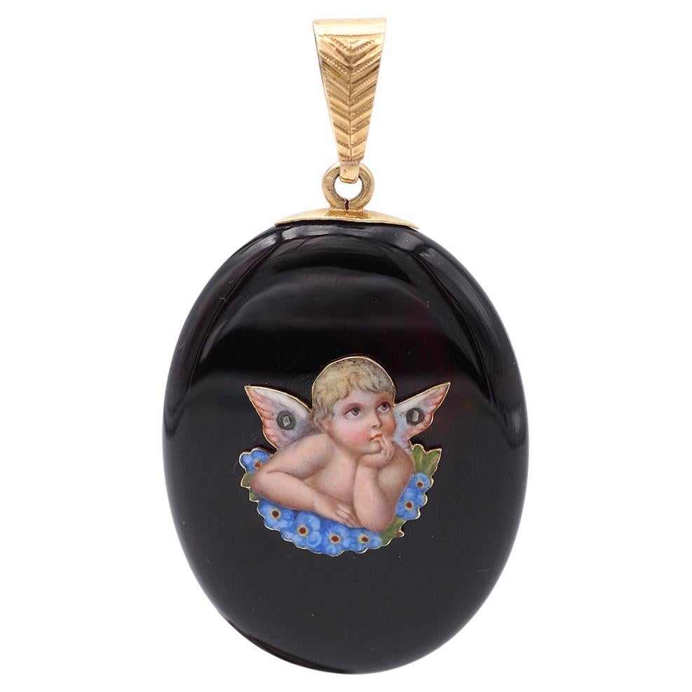 Victorian enameled angel with forget-me-not flowers onyx and 18k gold locket For Sale