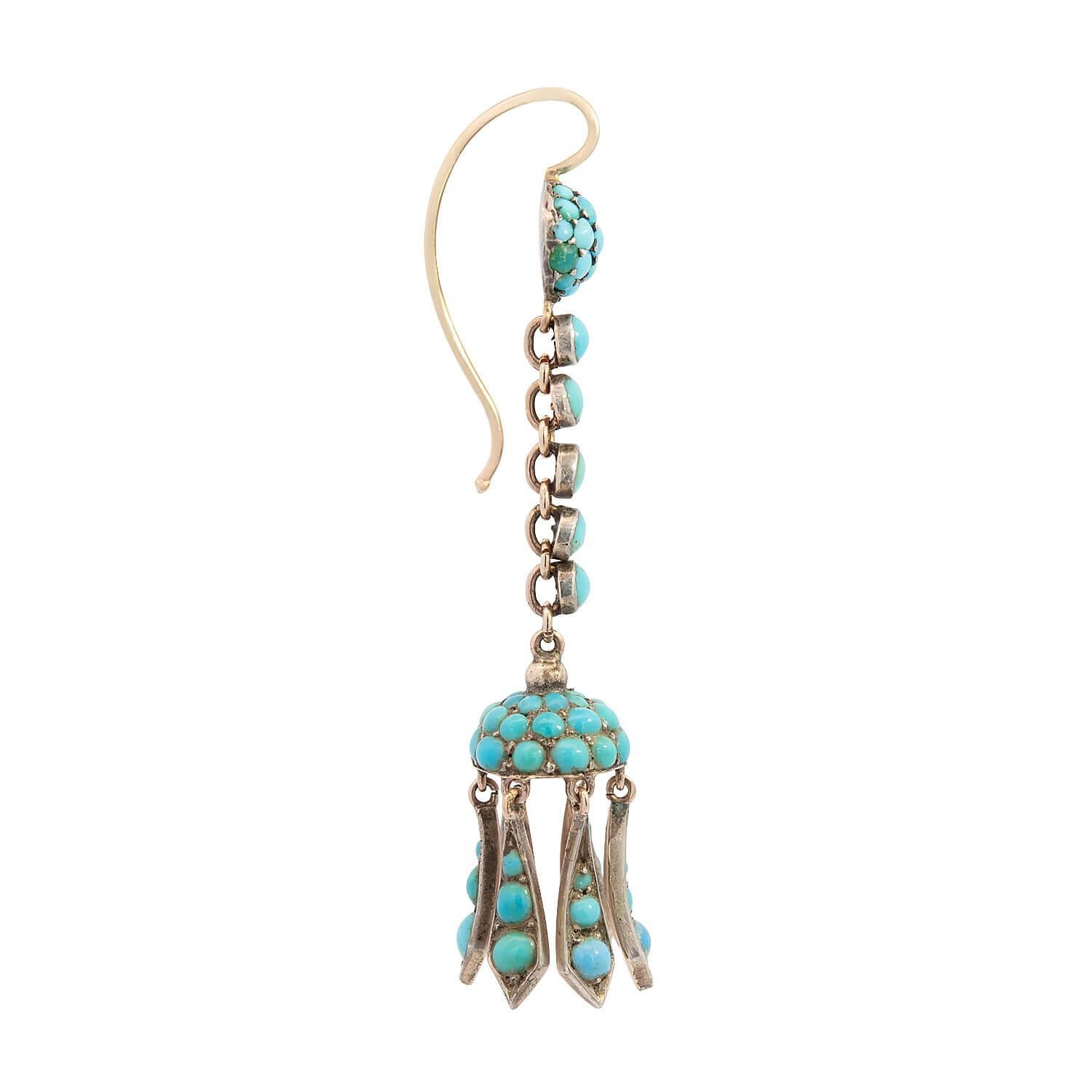 Wonderful English turquoise earrings from the Victorian (ca1880) era! Crafted in 14k yellow gold and sterling silver, the entire surface of the earrings is encrusted with turquoise stones. Each earring begins with a circular surmount, which is