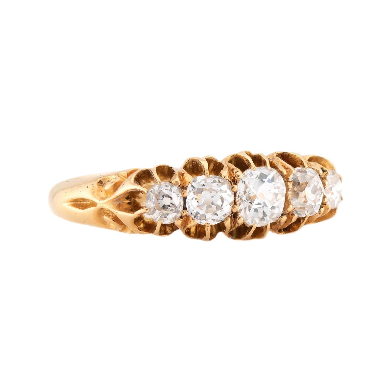An absolutely gorgeous 5-stone diamond ring from the Victorian (ca1880s) era! Crafted in 18k yellow gold, this ring features a row of 5 old mine cut diamonds running horizontally across the front surface of the piece. All of the stones are