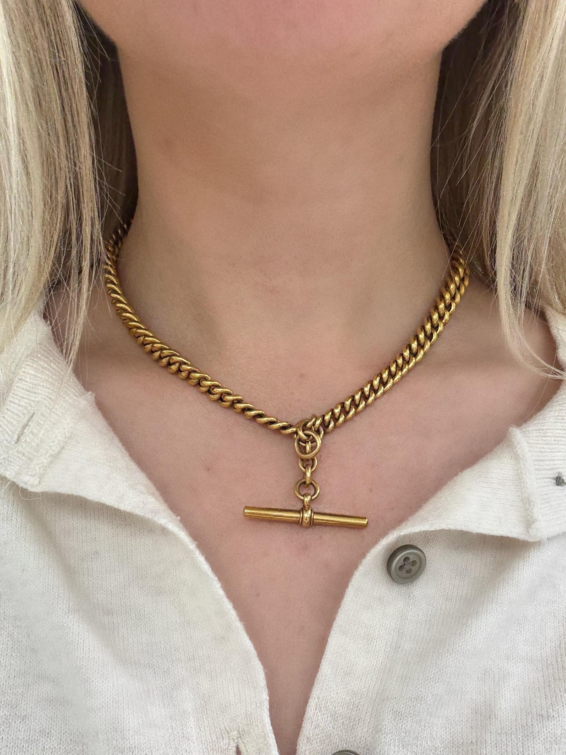 This rare watch fob necklace in a deep yellow color, with cable link chain, each stamped with 9c, Albert swivel clasps and a hanging T bar attachment. 

Measurements: 15 1/4 inches long
Metal: 9 carat yellow gold
Stamp: JC&S 9c
Gross weight: 29.80