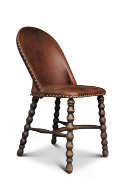 Victorian English Antique Leather Bobbin Chair With Tooled Heraldic Lion Decor