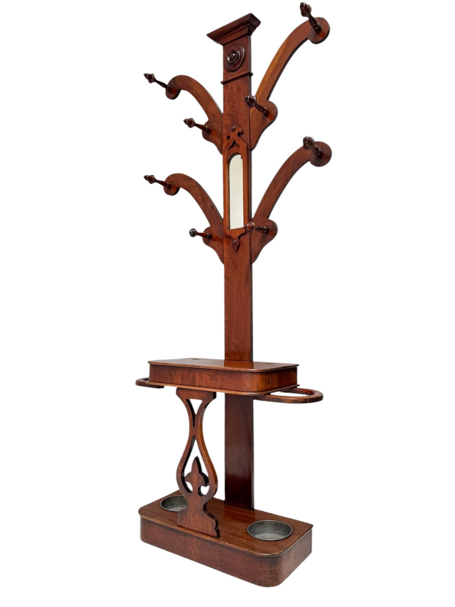 Stunning and elegant Victorian porte manteau or coat rack/stand.Solid American walnut and original American walnut veneered base with four shaped branches and eight original hanging hooks above two shaped umbrella holders with two original removable