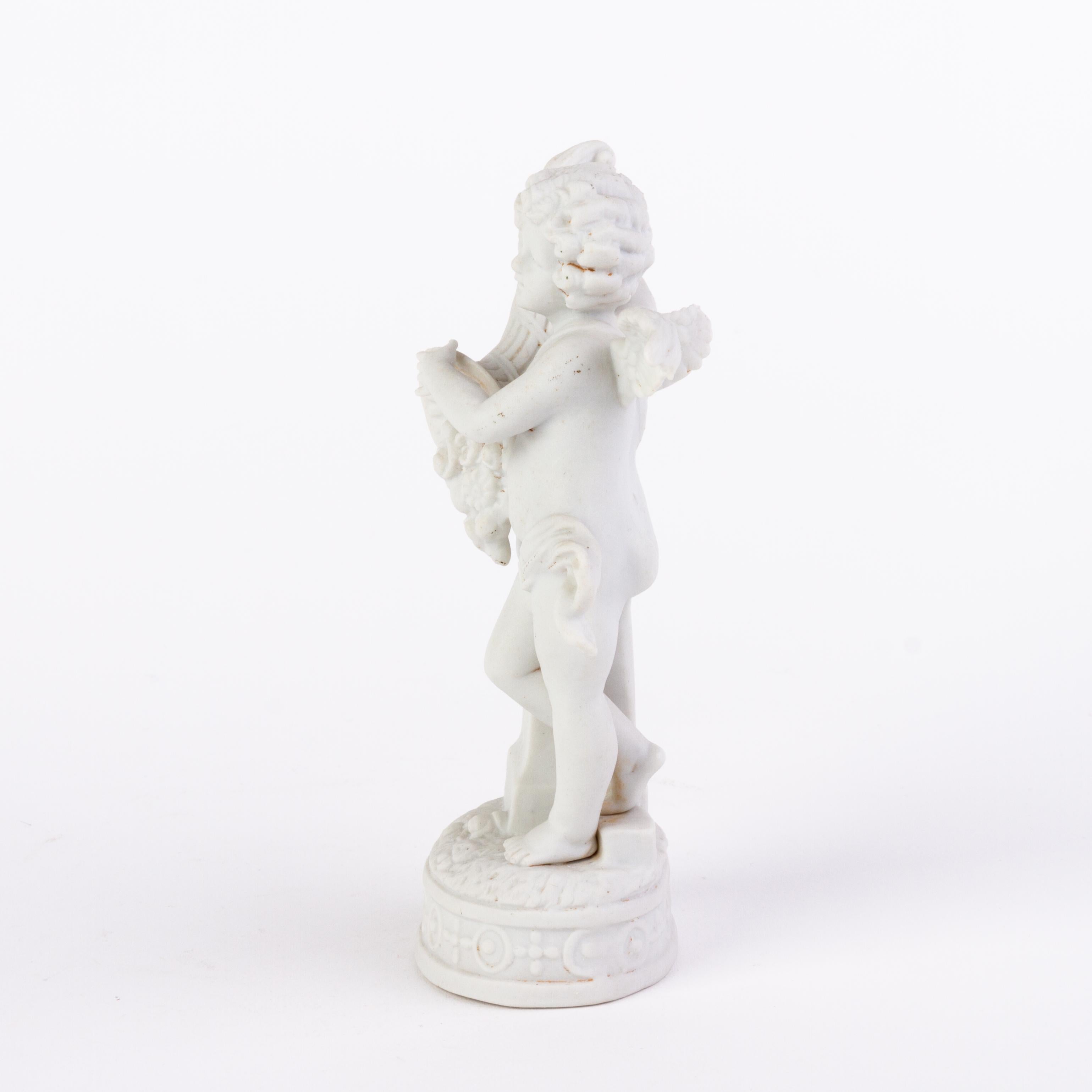 Victorian English Romantic Bisque Statue Cherub Holding Cornucopia 19th Century For Sale 1