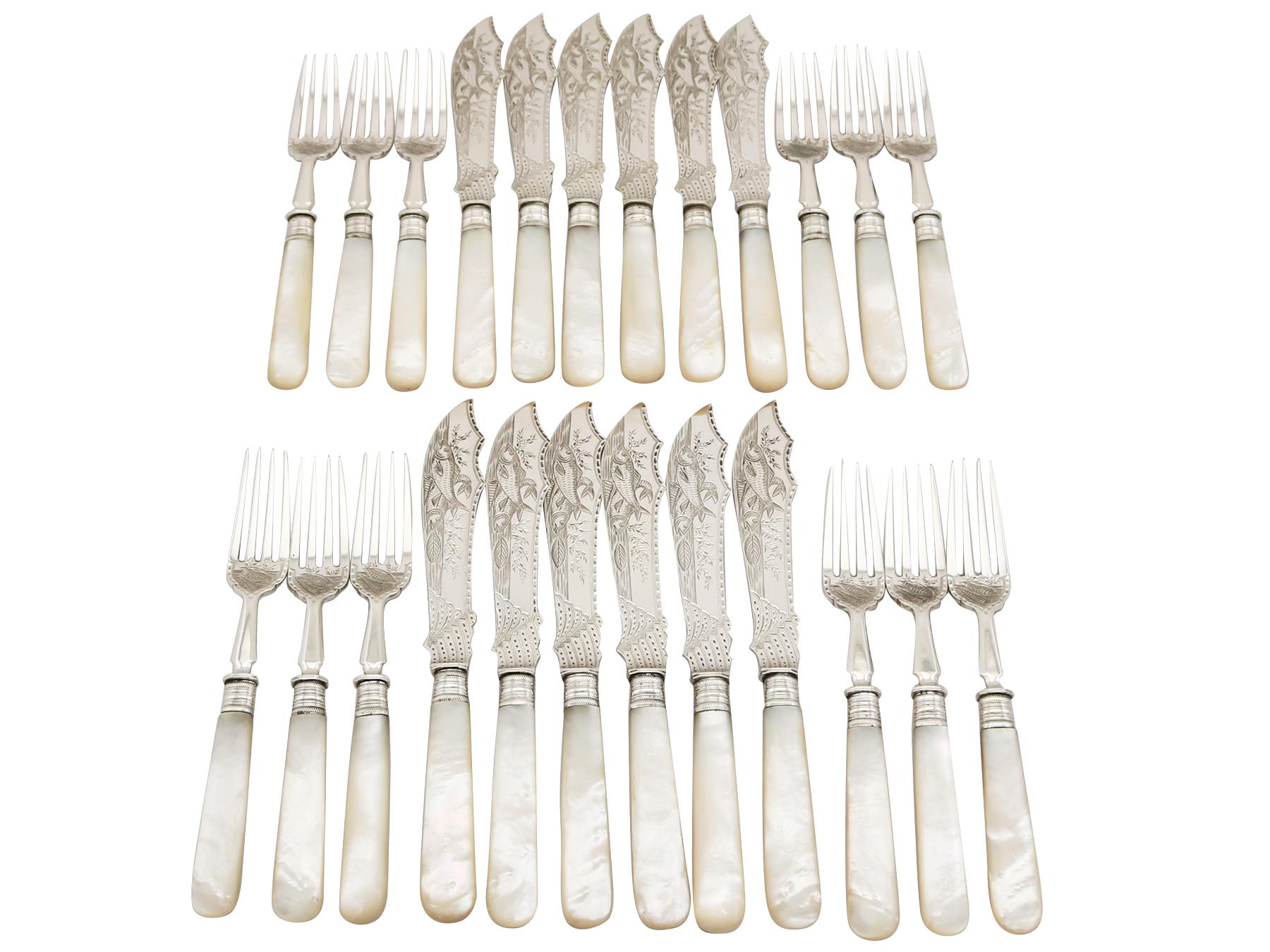 An exceptional, fine and impressive antique Victorian English sterling silver and mother of pearl handled fish service for twelve persons - boxed; an addition to our silver flatware collection.

This exceptional antique Victorian mother of pearl