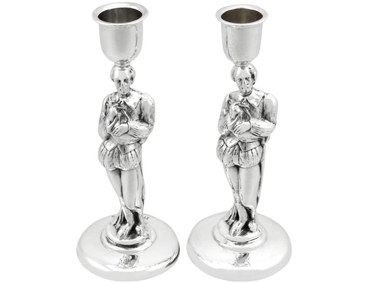An exceptional, fine and impressive pair of antique Victorian English sterling silver candlesticks; an addition of our ornamental silverware collection.

These exceptional antique Victorian sterling silver candlesticks have a circular rounded form