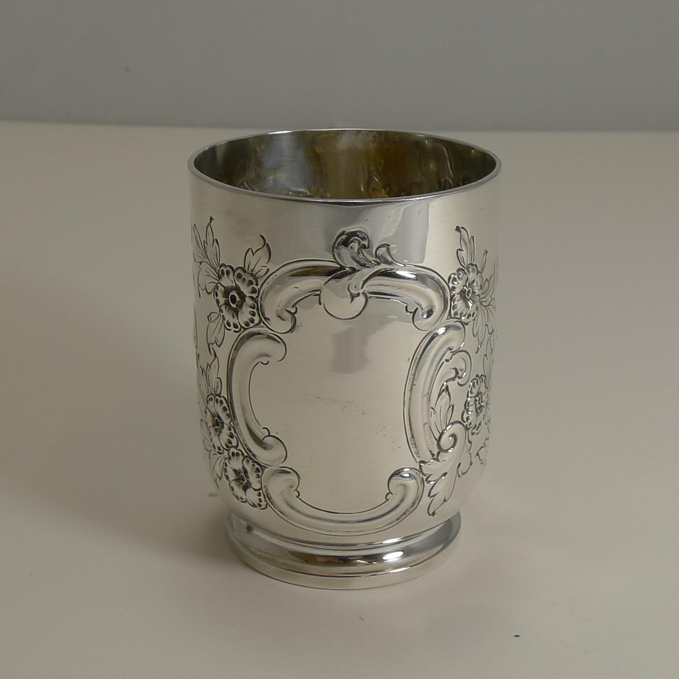 A stunning antique English Christening / child's mug perfect for an heirloom gift for the newest addition to your family.

A good gauge silver, the mug weighs 6.2 Troy Ounces / 192.9 grams. The mug has a beautiful all-over repousse and hand-chased