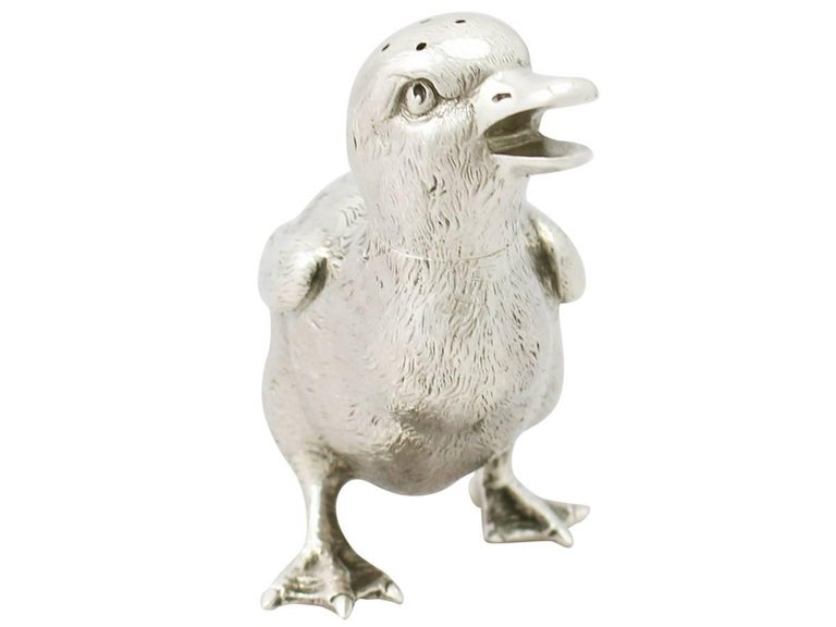 An exceptional, fine and impressive, rare antique Victorian English sterling silver pepper Shaker realistically modelled in the form of a duckling; an addition to our animal related silverware collection.

This exceptional antique Victorian