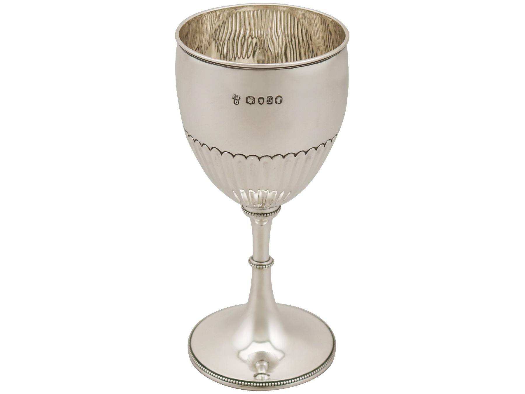 An exceptional, fine and impressive antique Victorian English sterling silver goblet; an addition to our collection of wine and drinks related silverware.

This exceptional antique Victorian sterling silver goblet has a circular bell shaped form