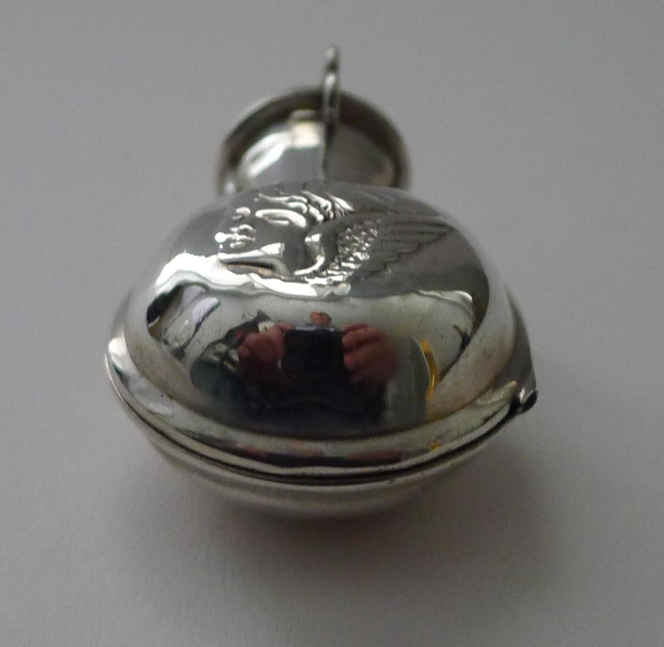This type of scent bottle is always highly sought-after, being more unusual than most, this one is a more charming smaller example, they are usually larger in size.

The case is made from sterling silver with an embossed winged Cherub or Putti