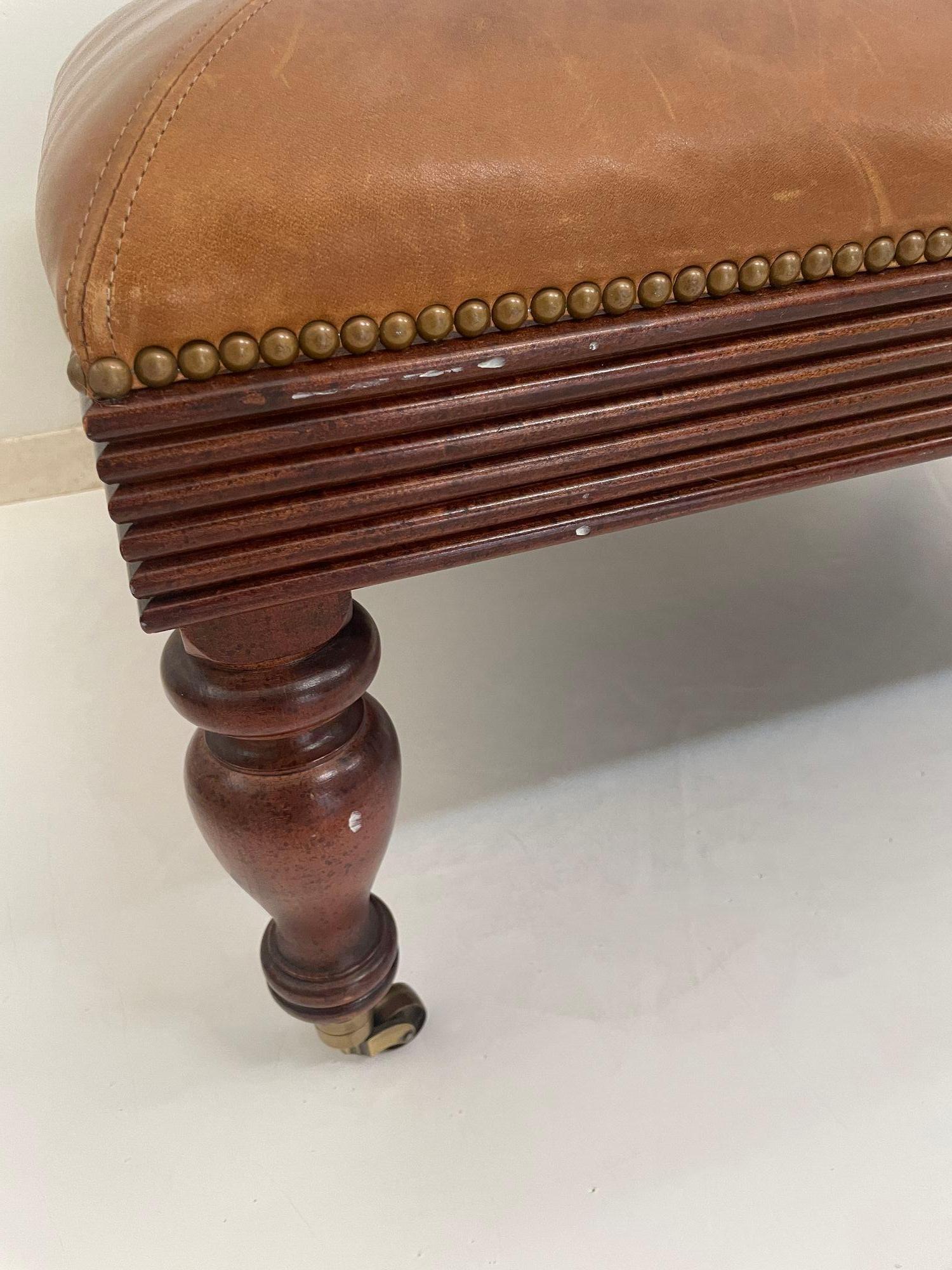 American Victorian English Style leather Ottoman with Brass Casters and Nailhead Trim For Sale
