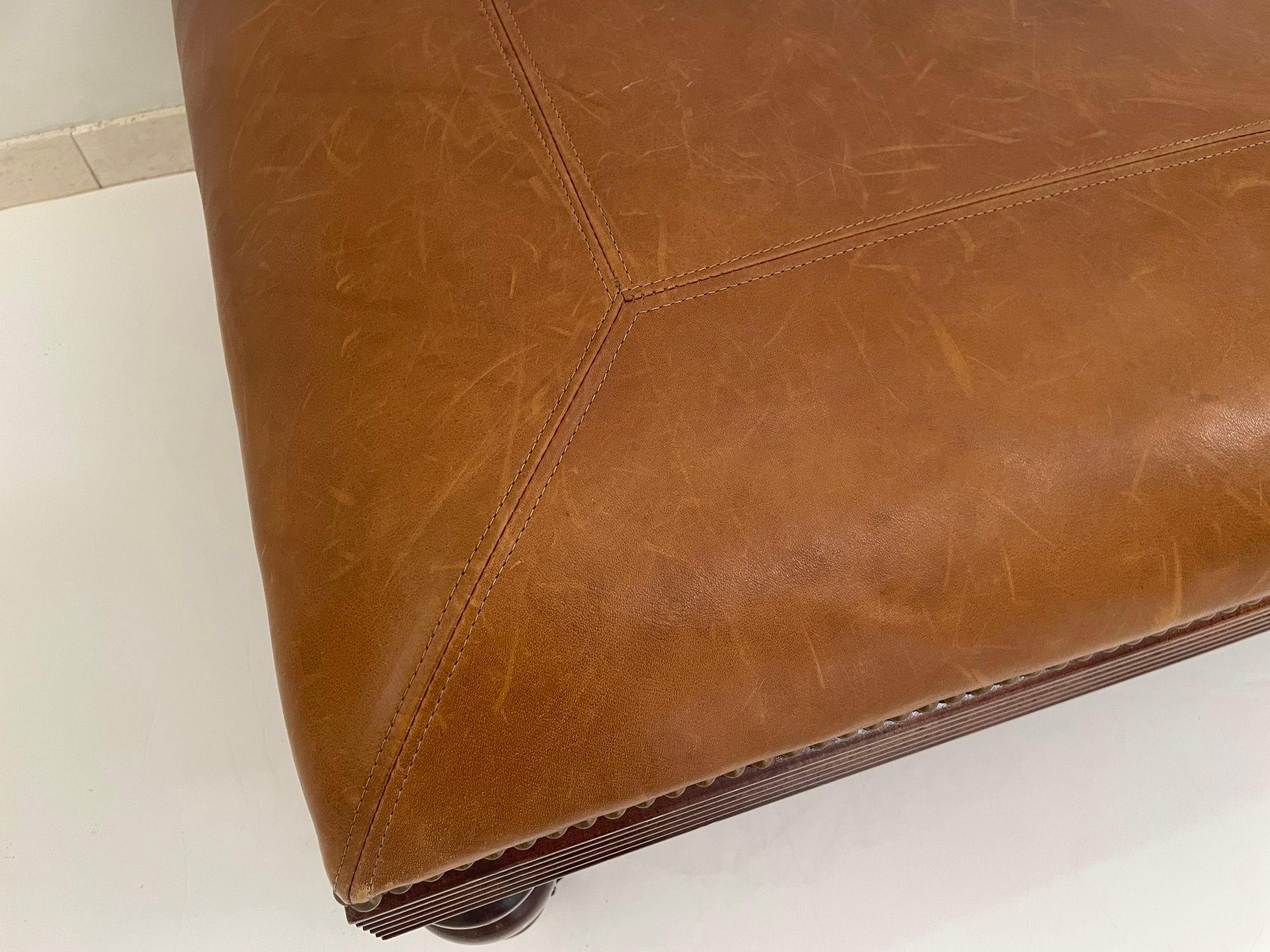 Victorian English Style leather Ottoman with Brass Casters and Nailhead Trim In Good Condition For Sale In North Hollywood, CA