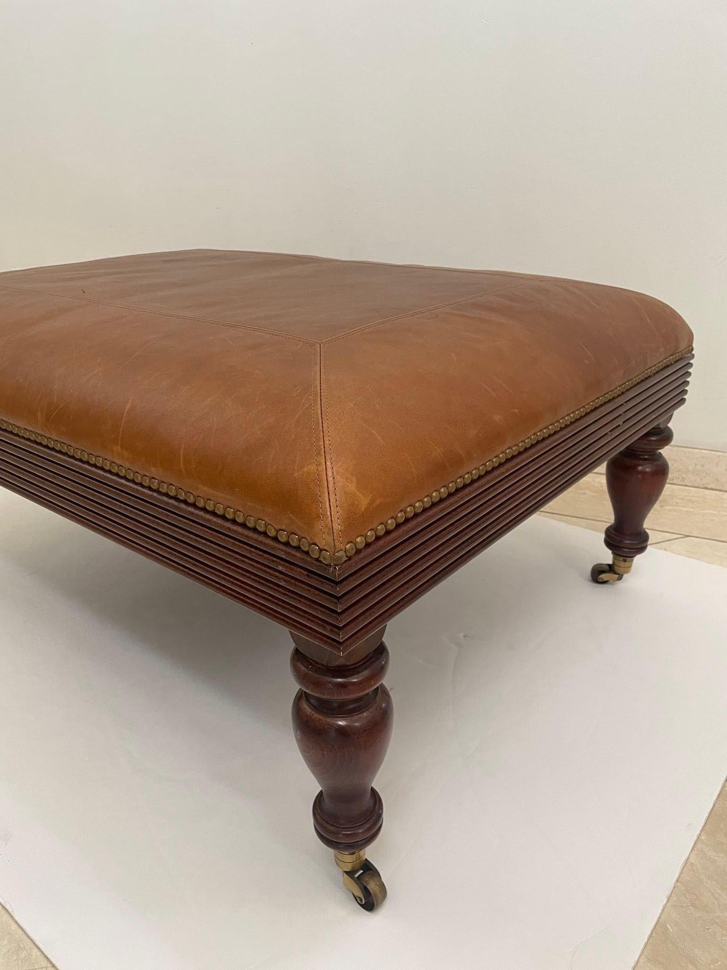 Leather Victorian English Style leather Ottoman with Brass Casters and Nailhead Trim For Sale