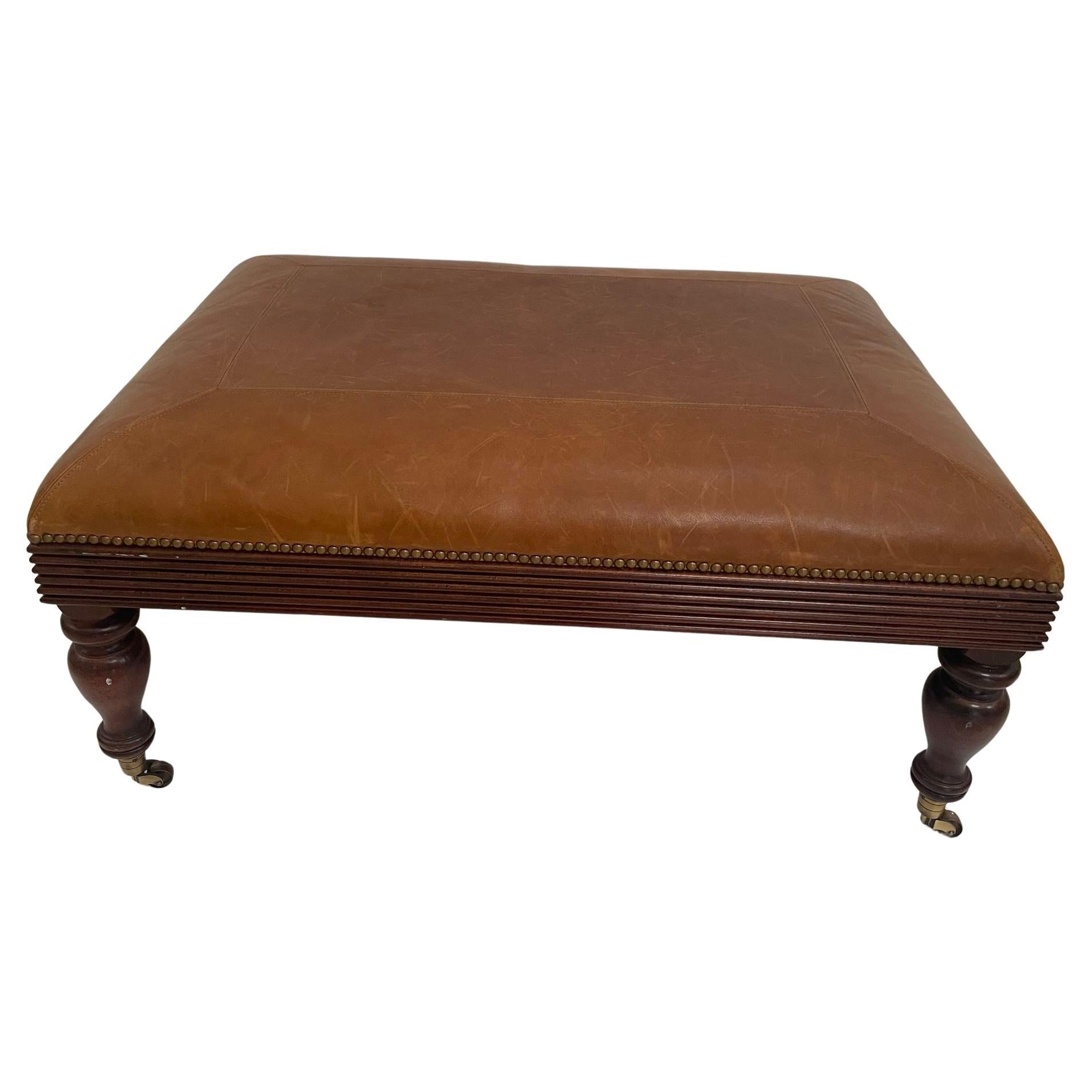 Victorian English Style leather Ottoman with Brass Casters and Nailhead Trim For Sale