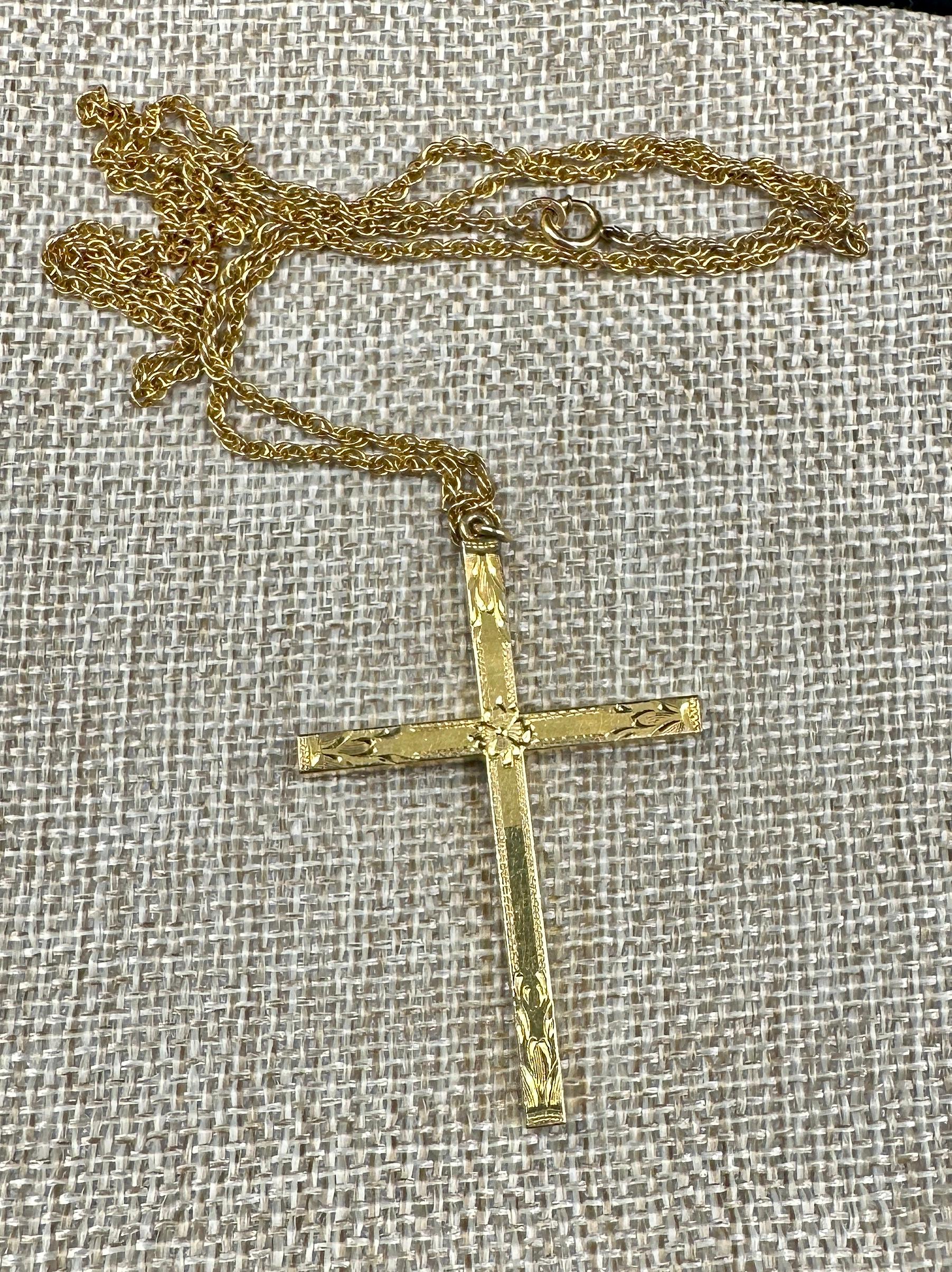 This is a beautiful antique Victorian Cross Pendant Necklace set with an engraved Gold Filled Cross with a flower motif in the center. The reverse of the cross is engraved with a single flower motif. The cross hangs from a lovely gold filled chain