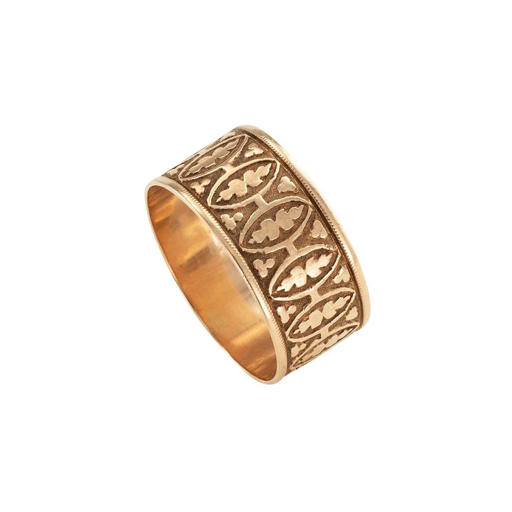 Victorian gold wedding band circa 1890.  *

ABOUT THIS ITEM:  #A8082. Scroll down for specifications.  This is a wide wedding band decorated by a repeating organic motif that has developed a lovely patina indicative of time spent across the decades