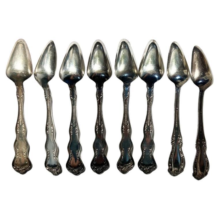 A set of 8 silverplate Victorian fruit spoons by Holmes & Edwards. This set is engraved with what appears to be the letters CB. Two of the spoons have a slightly different pattern on the handle than the others, but it was so similar that we barely