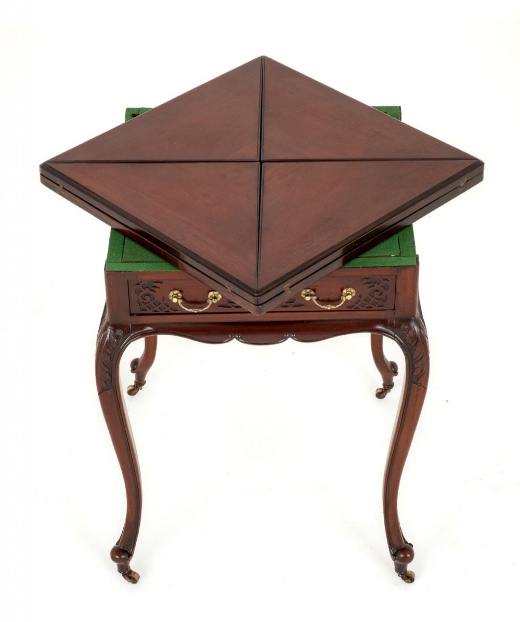 Pretty late Victorian mahogany envelope card table.
This table stands upon shaped legs with carved toes and brass castors.
circa 1890
The knees of the legs having carved decoration.
The card table features 1 mahogany lined drawer with fret work